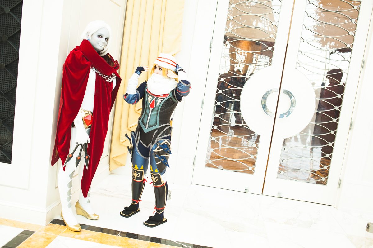 Cosplayers take a break from photographs (well, sorta).