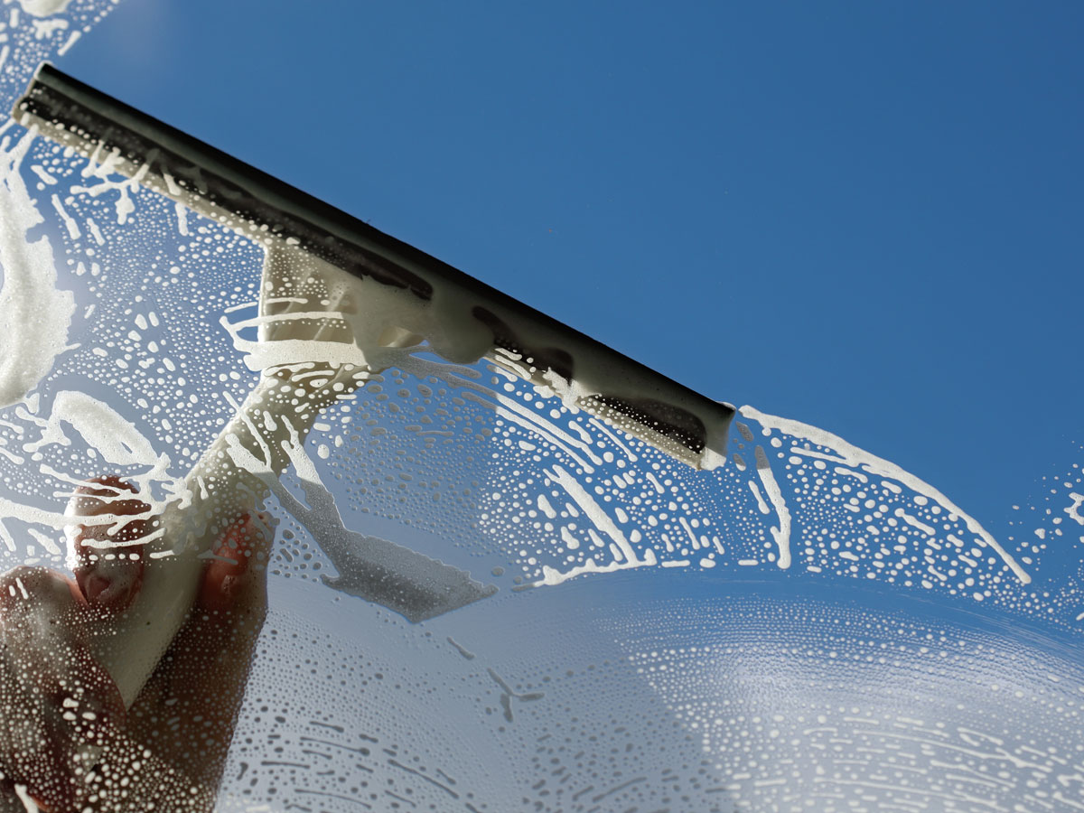 Window-Cleaning-with-a-squeegee-in-Appleton-WI.jpg
