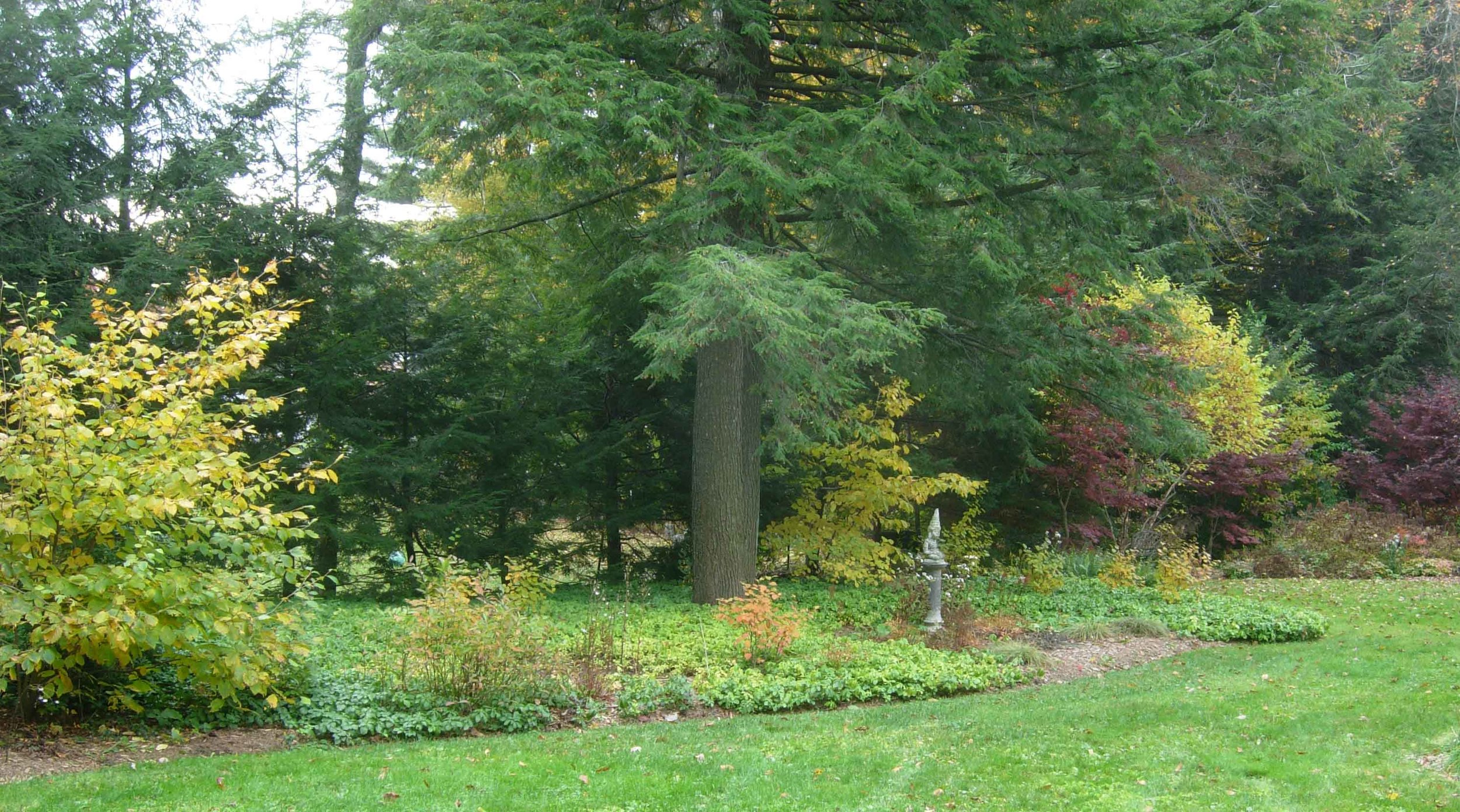 Using defined edges and garden art.
