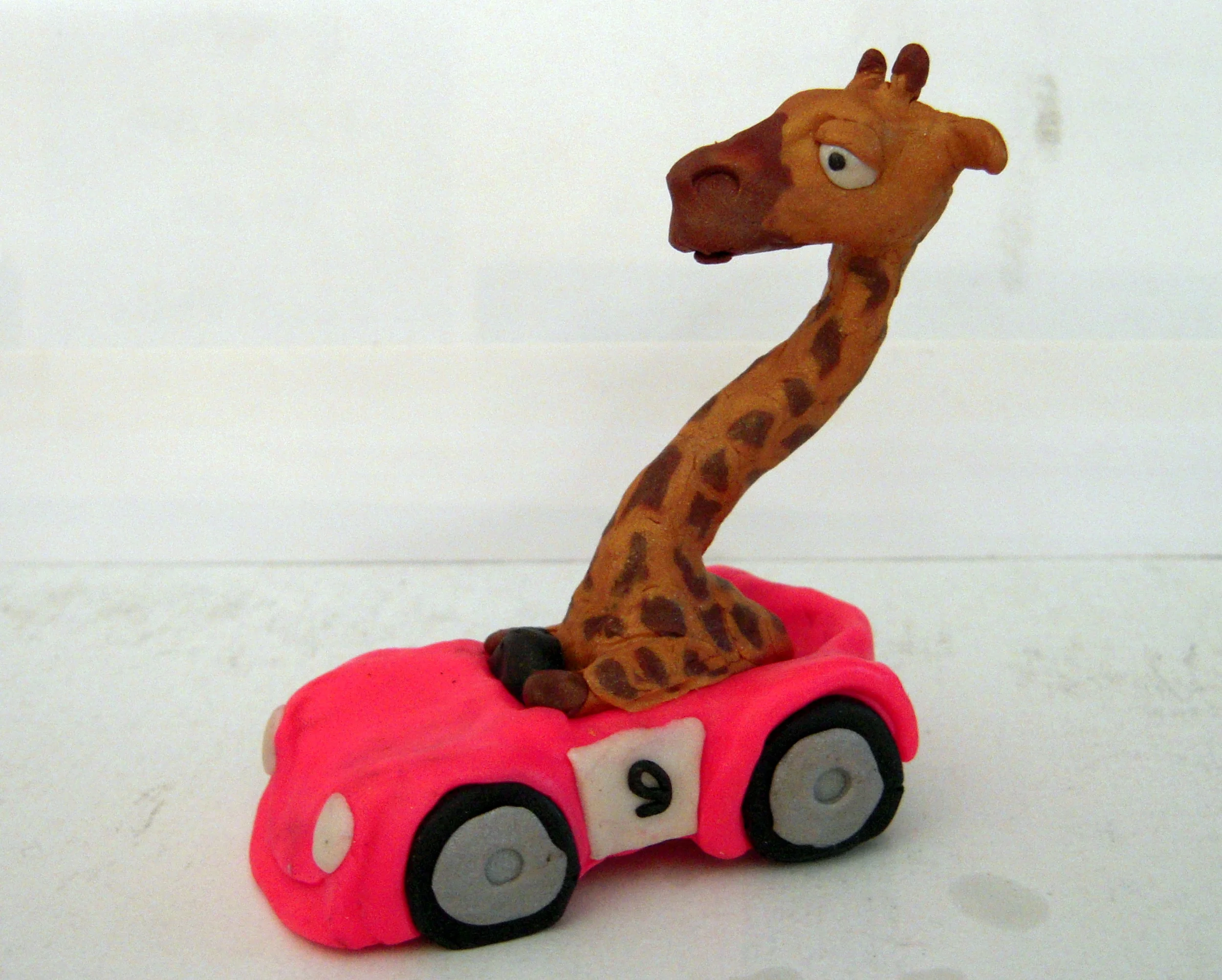 Giraffe in Racecar (side view)