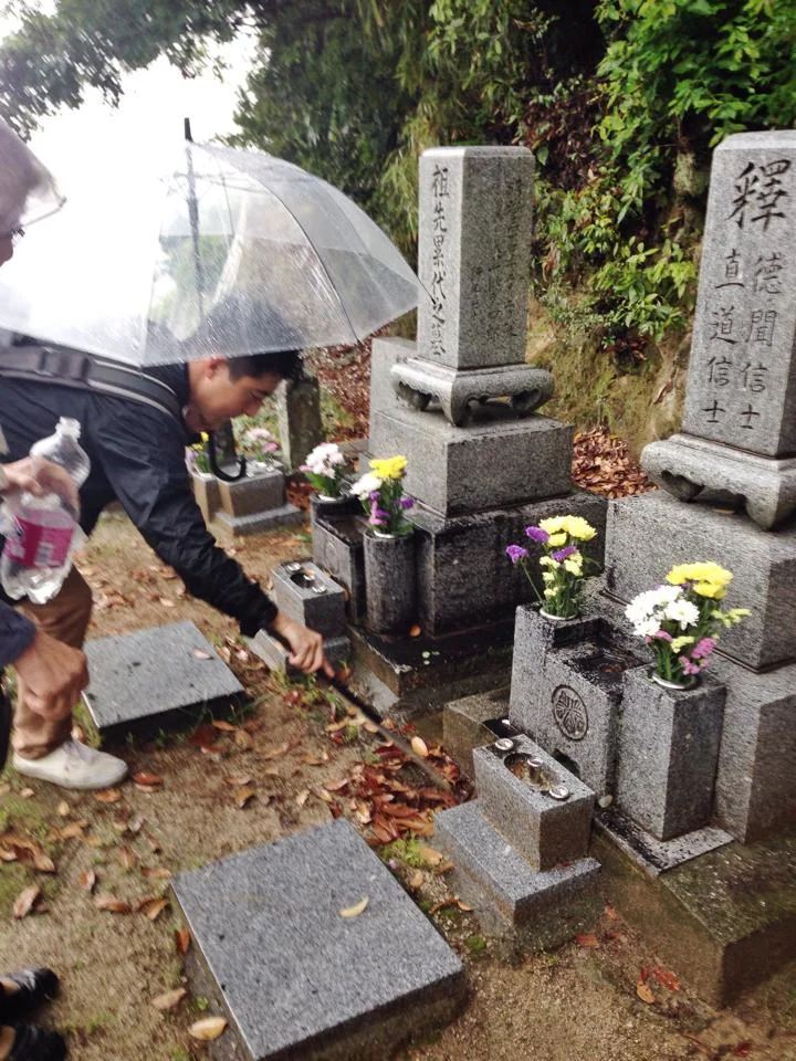 My brother, Todd, cleaning my grandfather's sister's family's headstones.