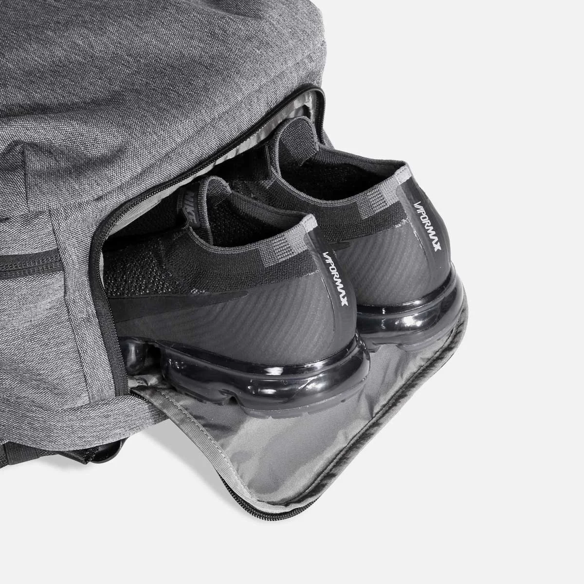 Separate compartment for shoes or dirty clothes.