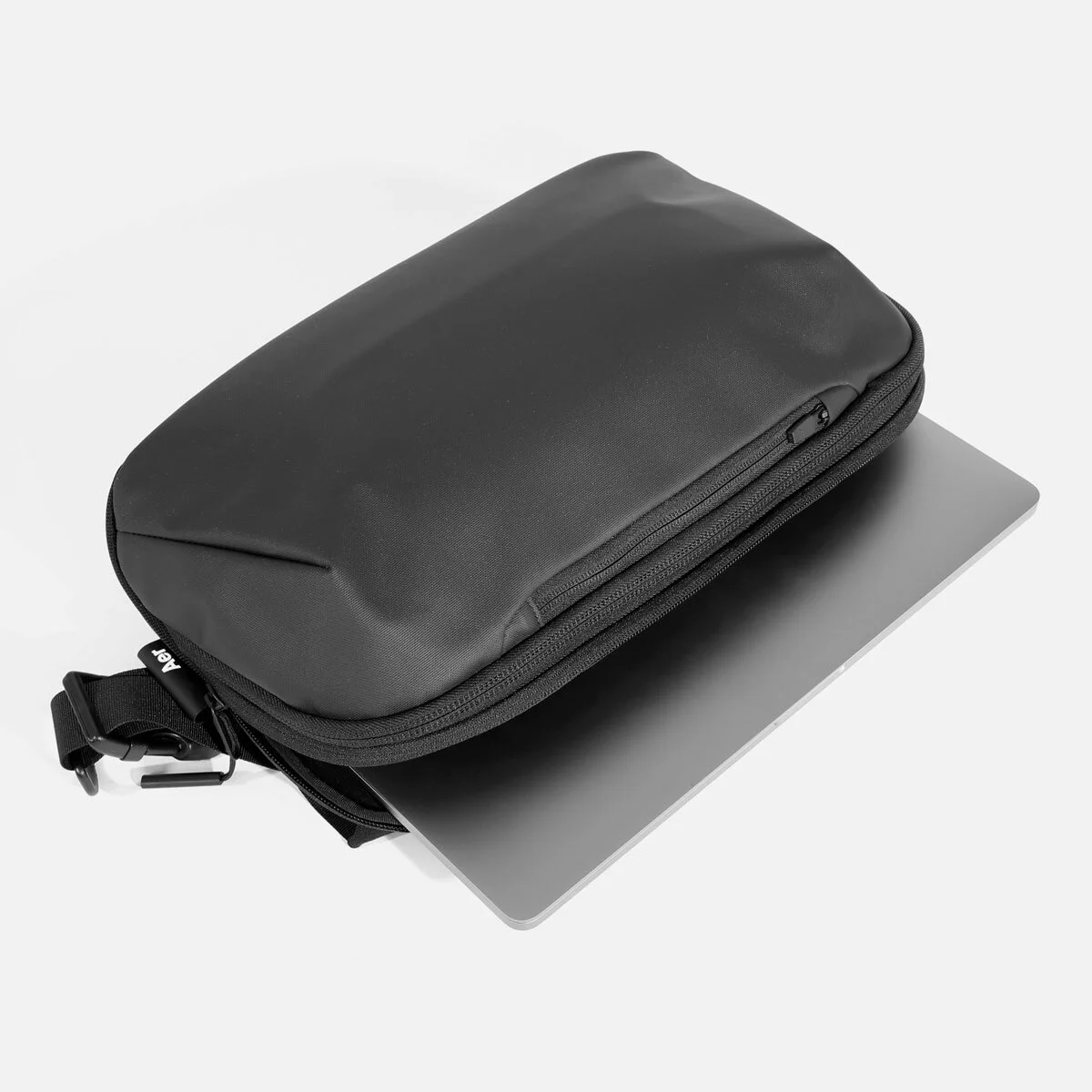 Separate, quick-access laptop pocket (fits up to 13" laptop) with cushioned soft lining.