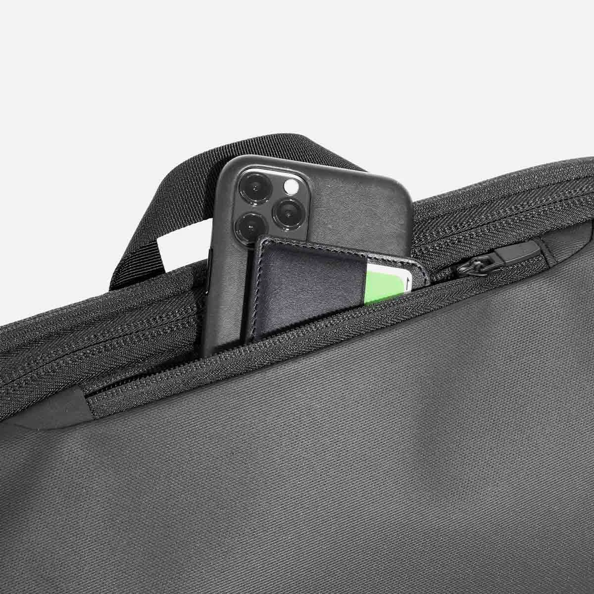 Quick-access top pocket with soft lining.