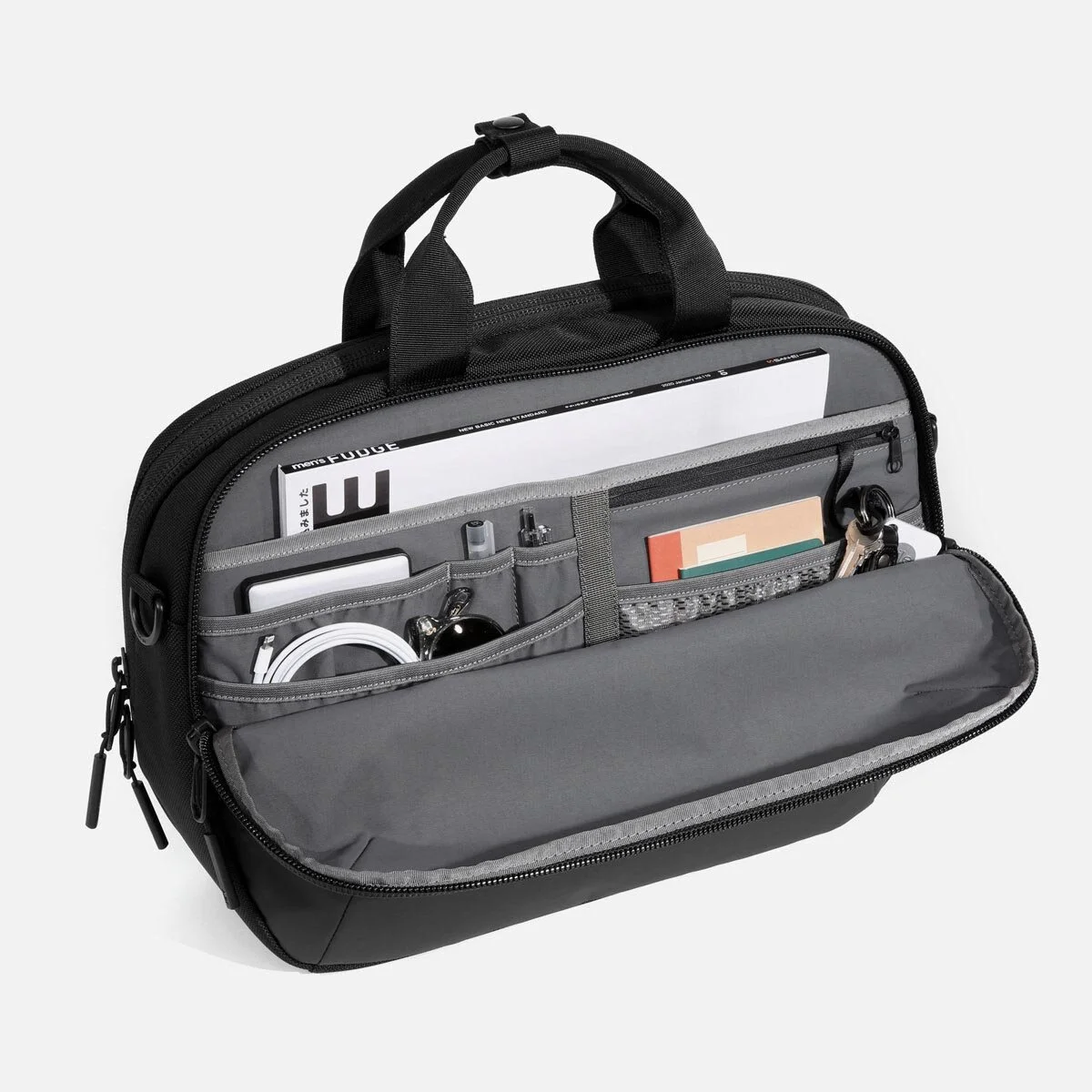 Toolbox-inspired design keeps bag upright.