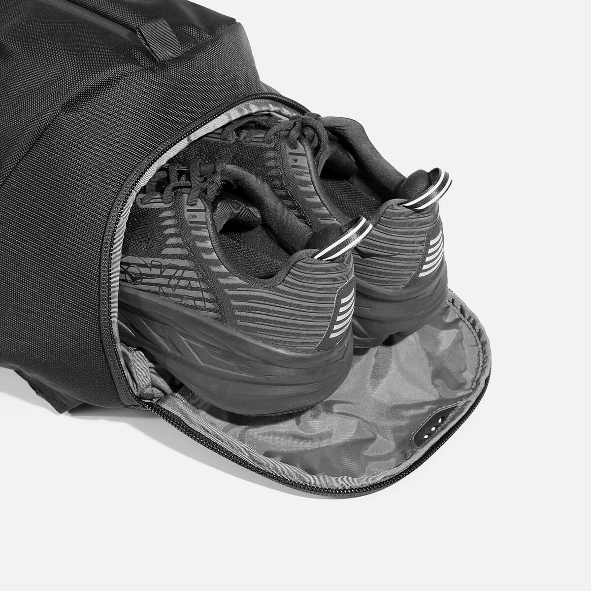 Ventilated shoe compartment with stowaway design.