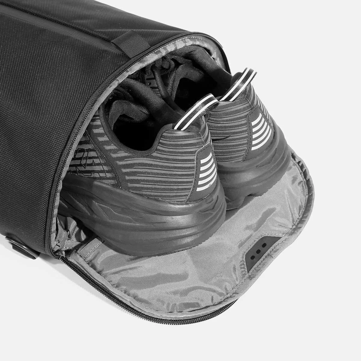 Ventilated shoe compartment with stowaway design.