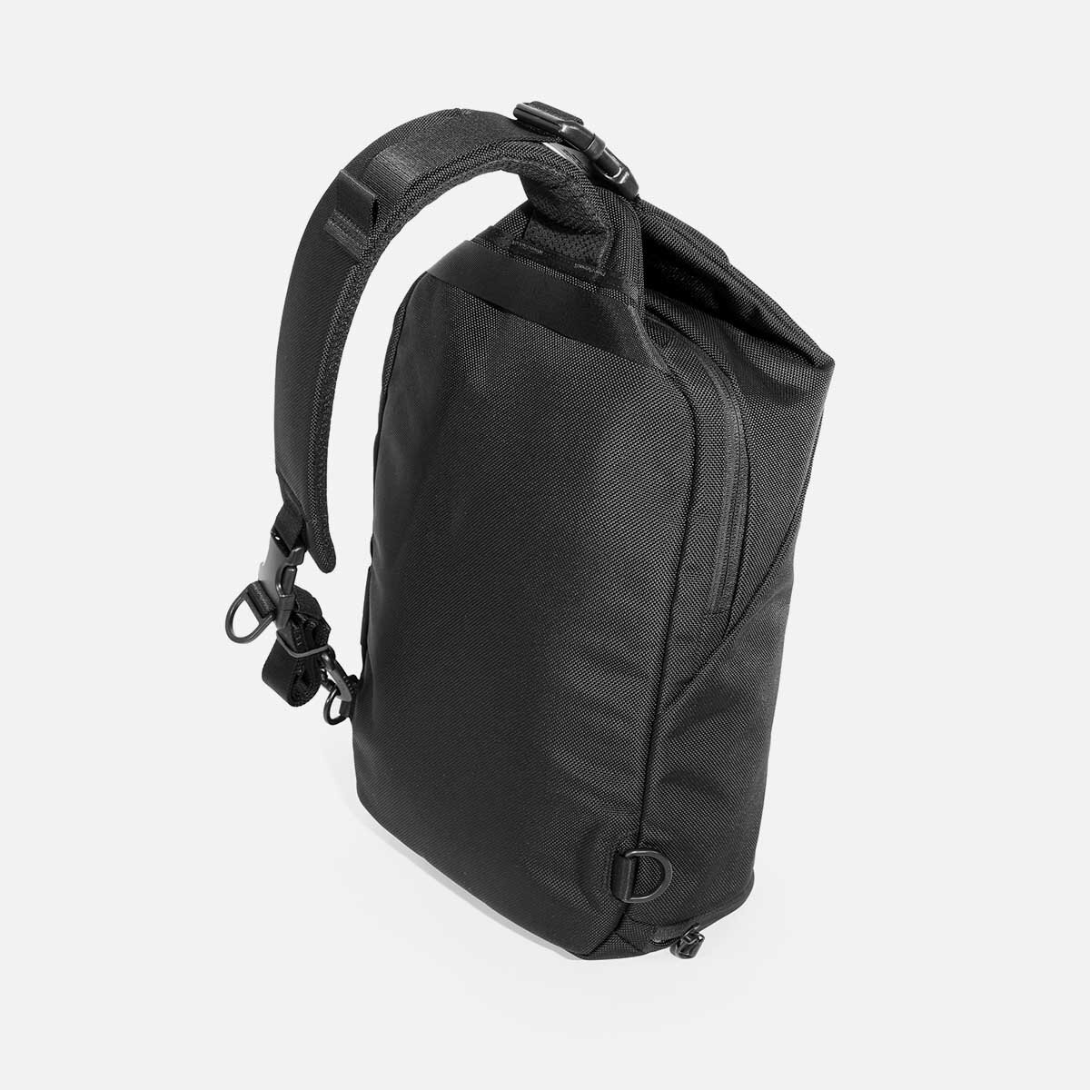 Padded shoulder strap adjusts for left or right shoulder use