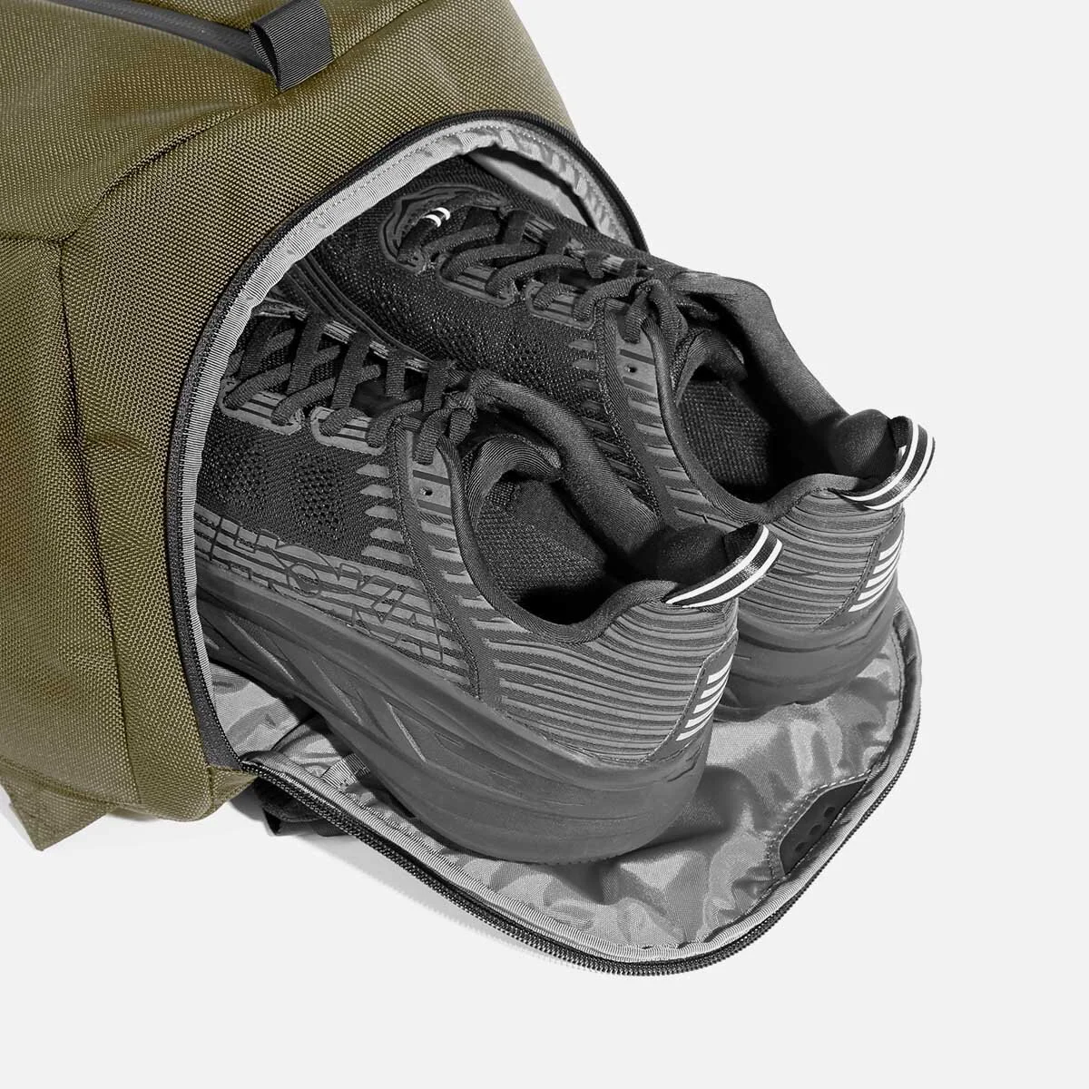 Ventilated shoe pocket with stowaway design.
