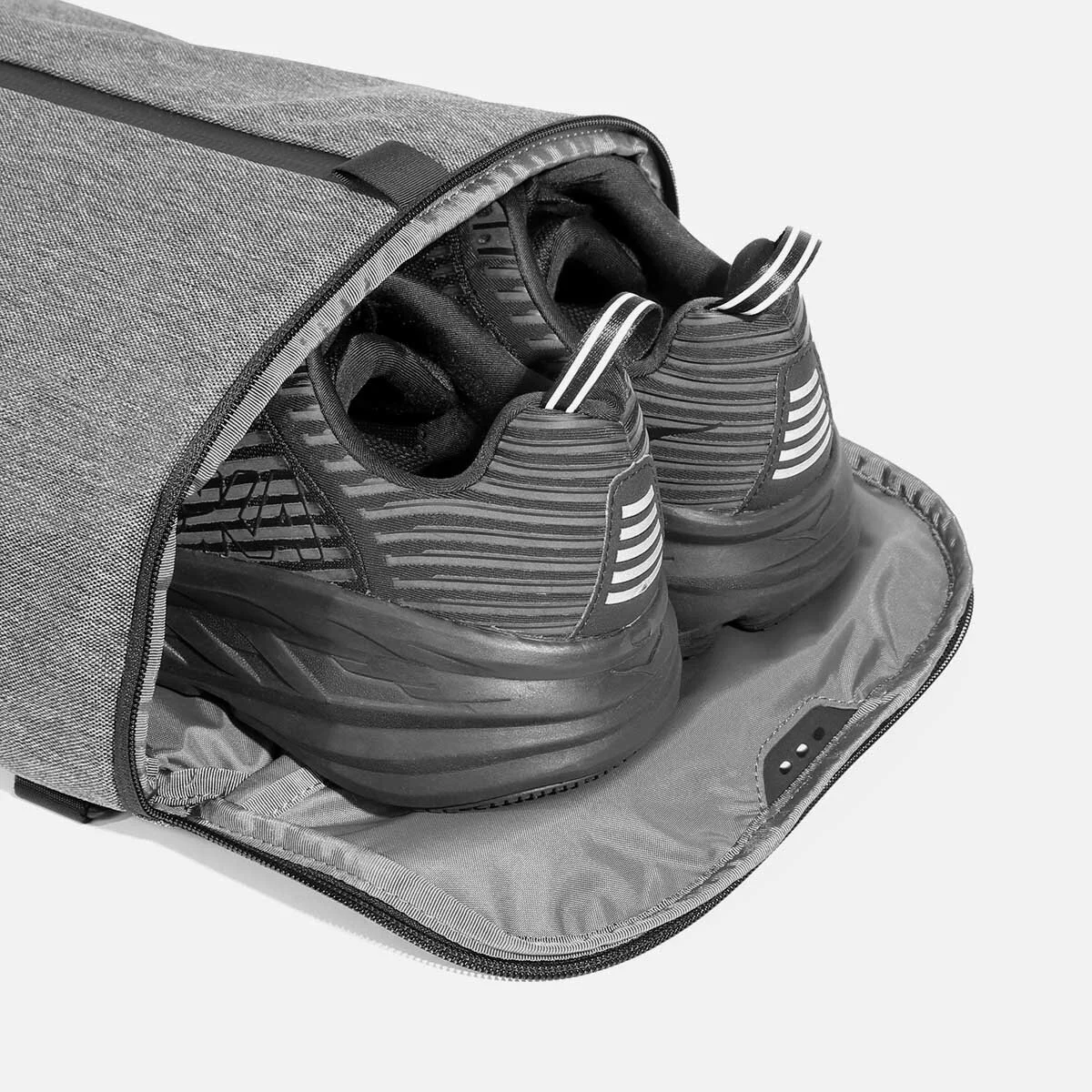 Ventilated shoe compartment with stowaway design.