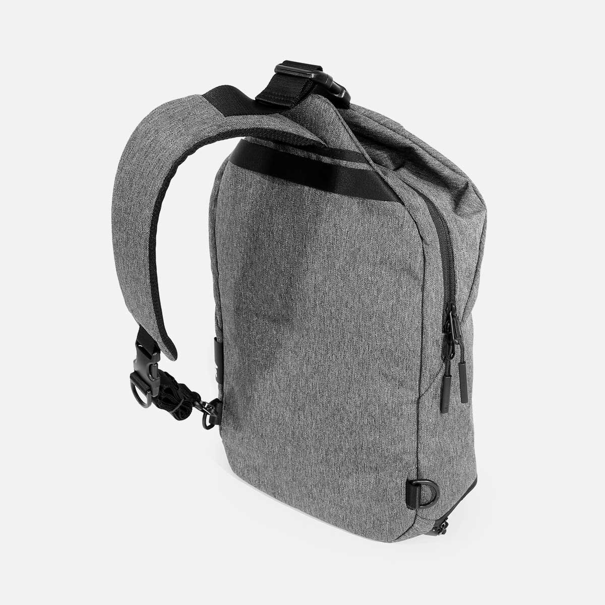 Padded shoulder strap adjusts for left or right shoulder use