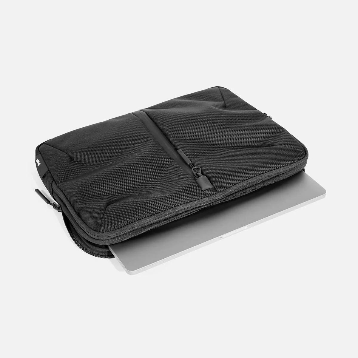 Padded, quick-access laptop pocket with soft lining (fits up to MacBook Pro 16" laptop).
