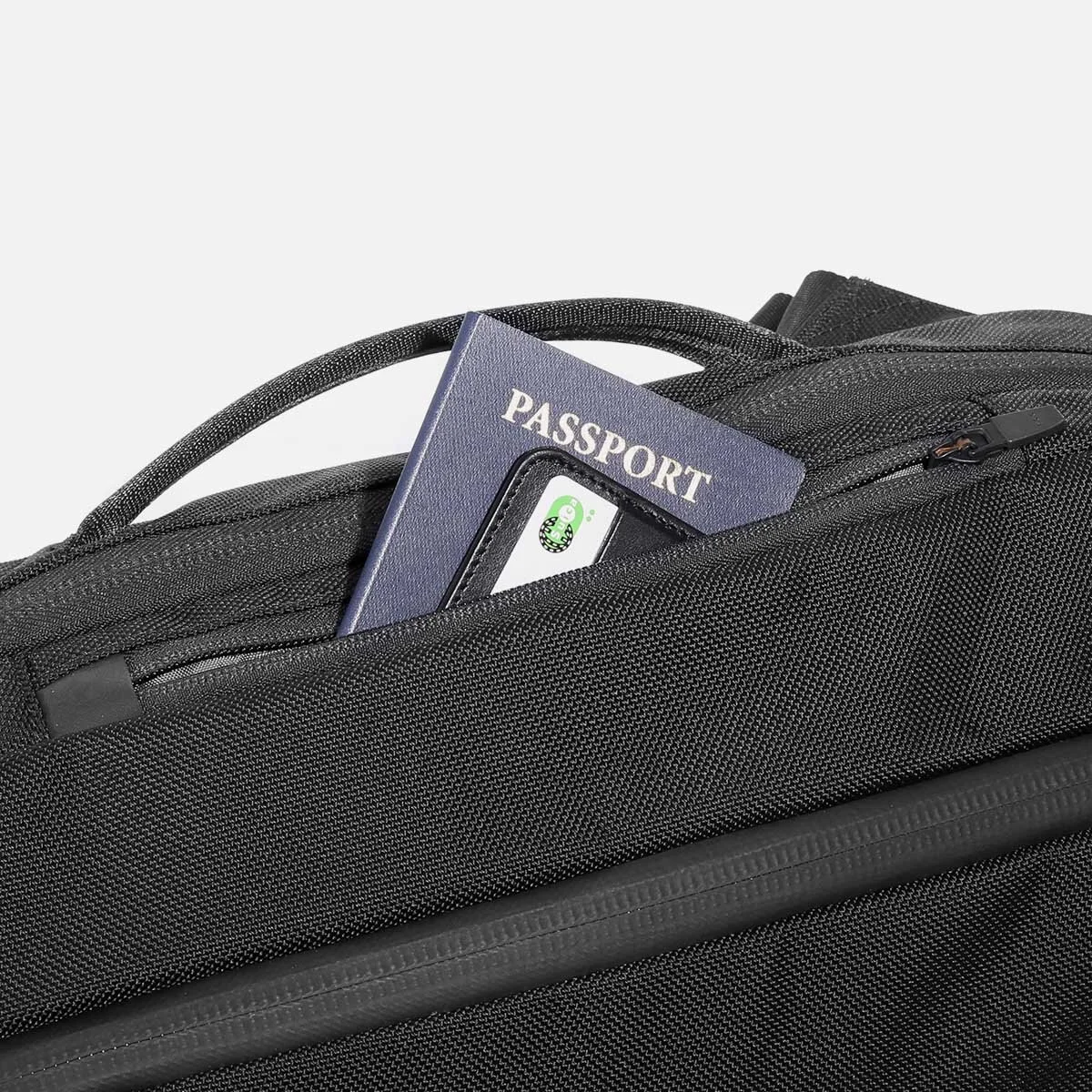 Quick-access top pocket for travel documents and small valuables.