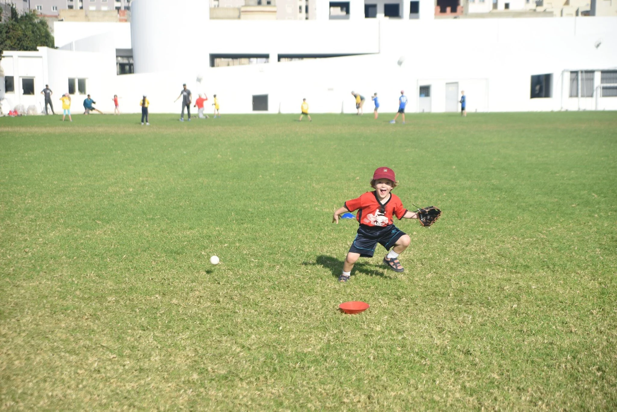 boy fielding big smile.jpg
