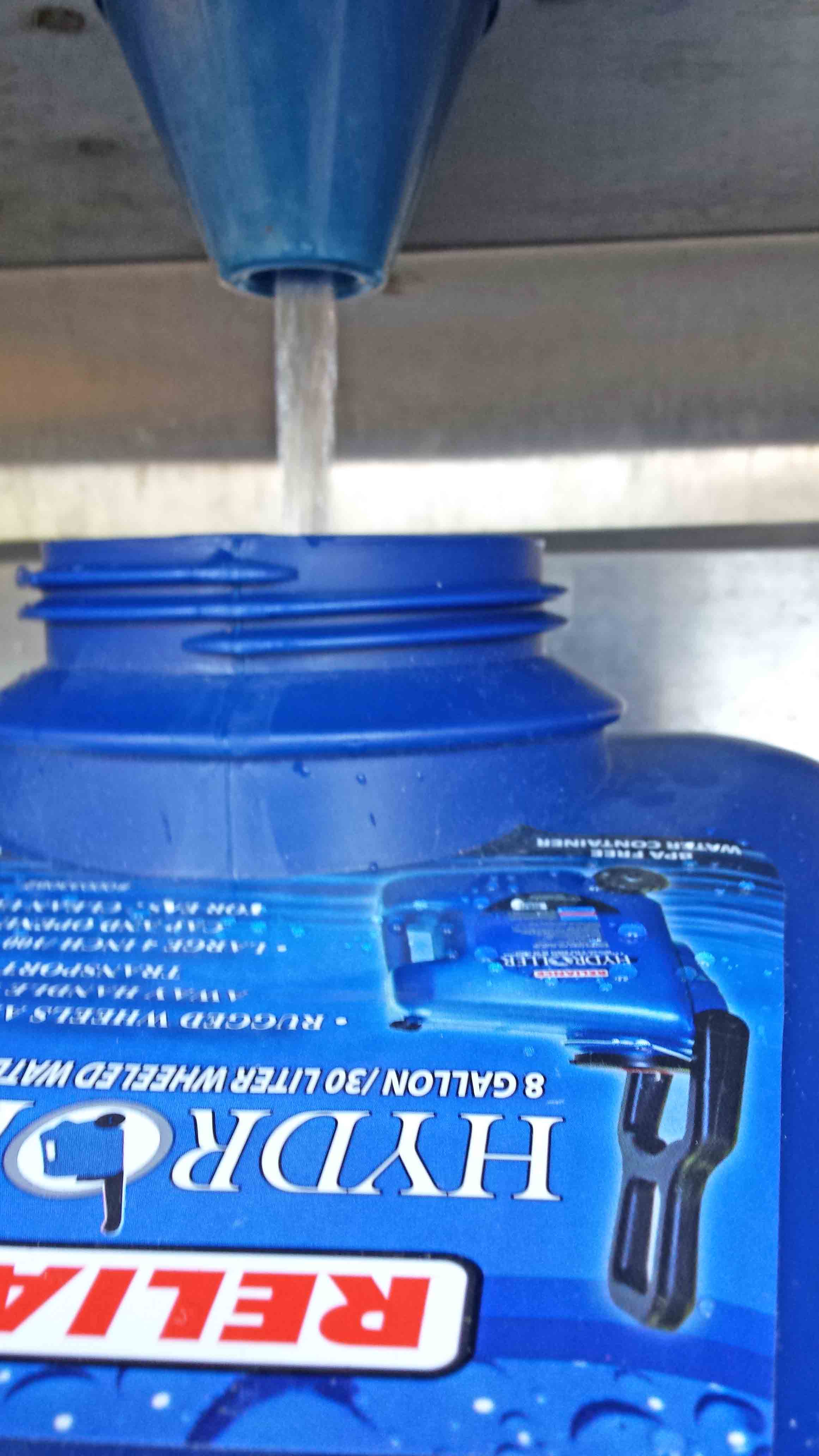 Here I am, in front of Safeway, refilling our water bottles during evacuation. Just one little catch - no quarters for the water machine. Another lesson learned. Keep your eyes out for water refill stations like these,