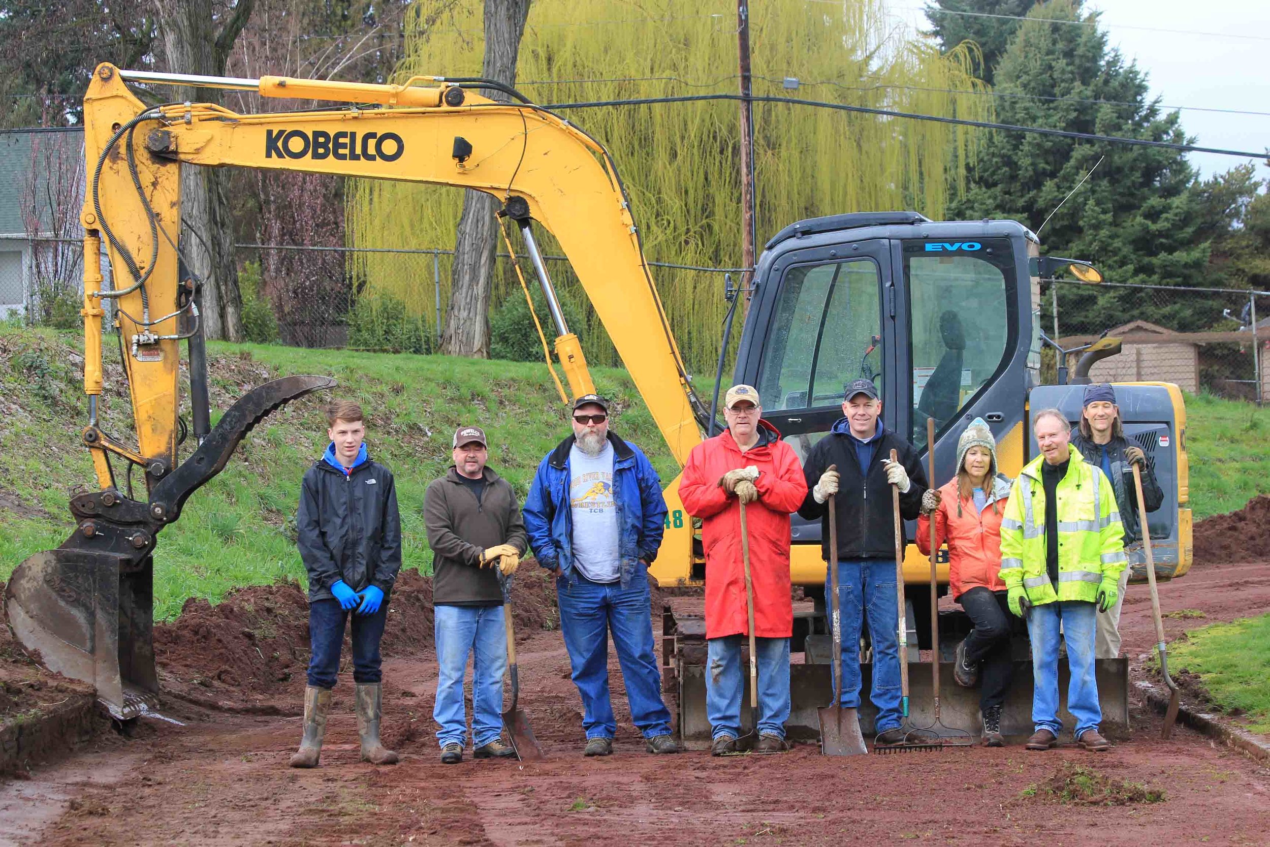 Hood River Rotary service project at Hood River Middle School 2016 - cleaning up the track. That's me, Barb, on the right - the girl. Photo: Michael McElwee