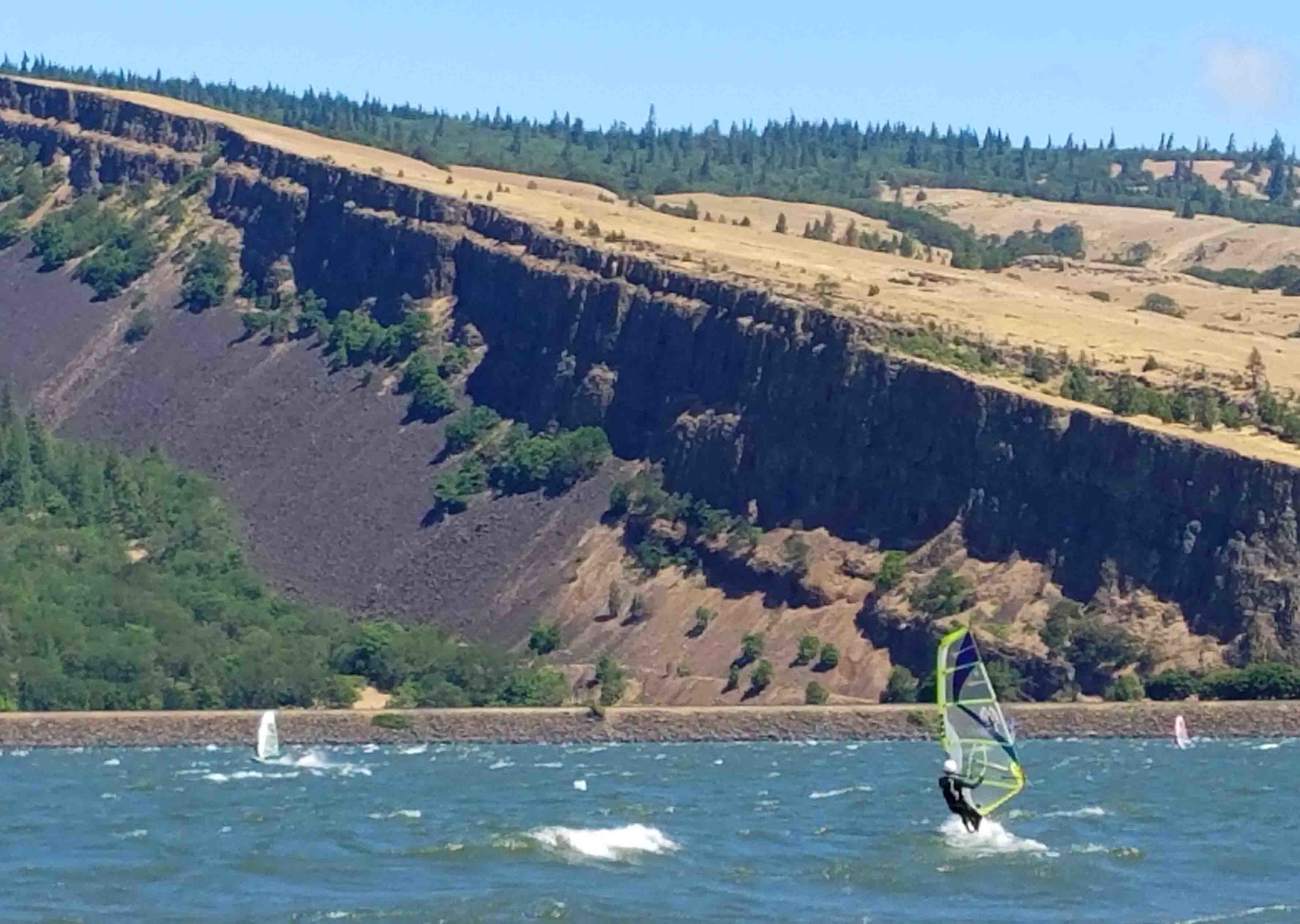 Big Wind day at Mosier’s Rock Creek beach. Sailing over powered on a 3.2 last weekend. Wind is too big for Doodle, so he’s hanging on shore. Photo: (c) Barb Ayers, DogDiary.org