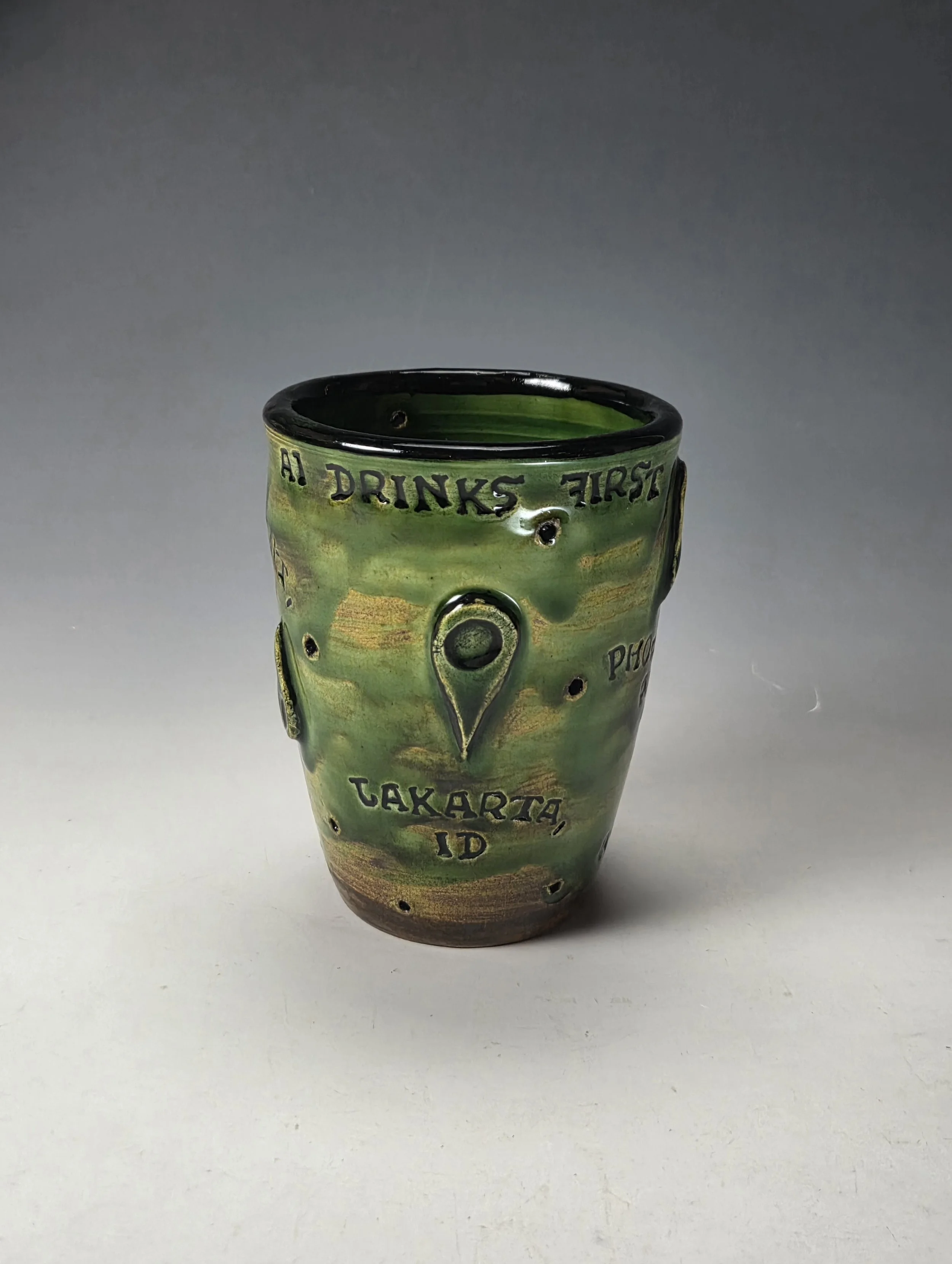 Max Parrish,
Data Center Cup; Low-Fire clay, engobe, sprigs, letter stamps, 04 glazes; 5 x 4 x 4"
