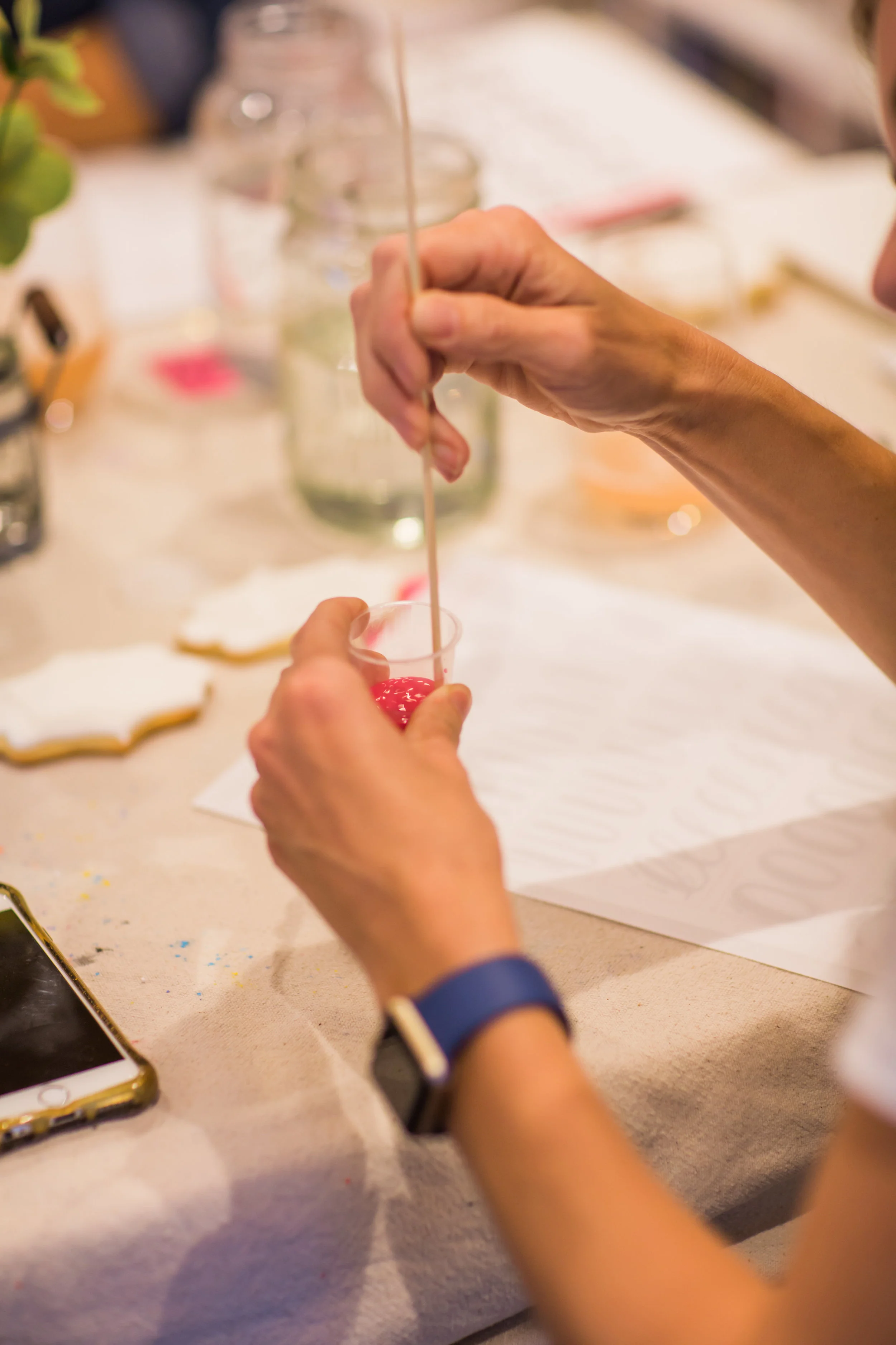 Mixing watercolor paint for brush lettering. Photo credit: Melissa Lewis Photography