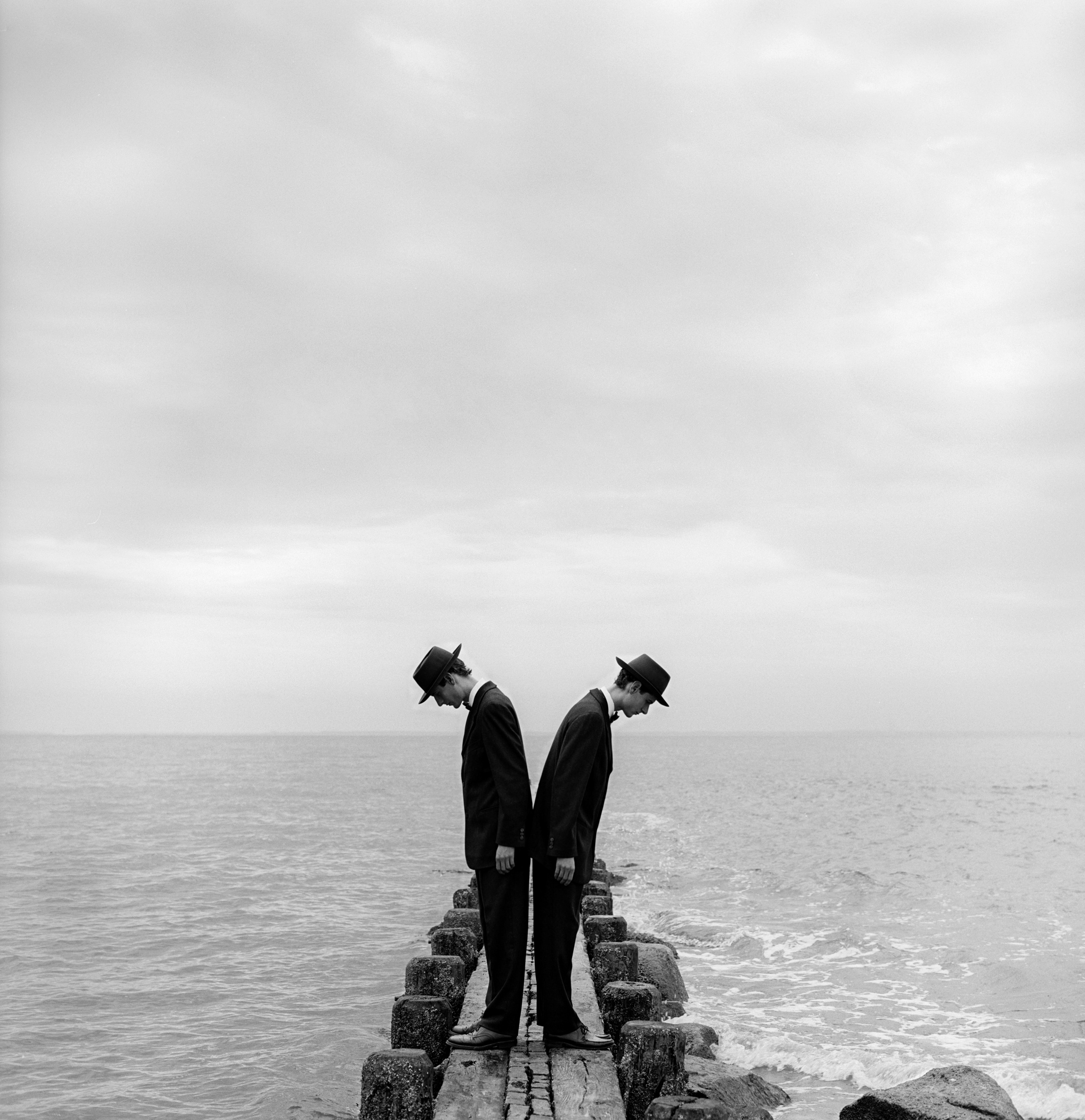   Twins Leaning Outward on Dock&nbsp;no.1, Sherwood Island, CT  1997 Silver gelatin print 27 x 27 cm (image) 56 x 66 cm (mount) 