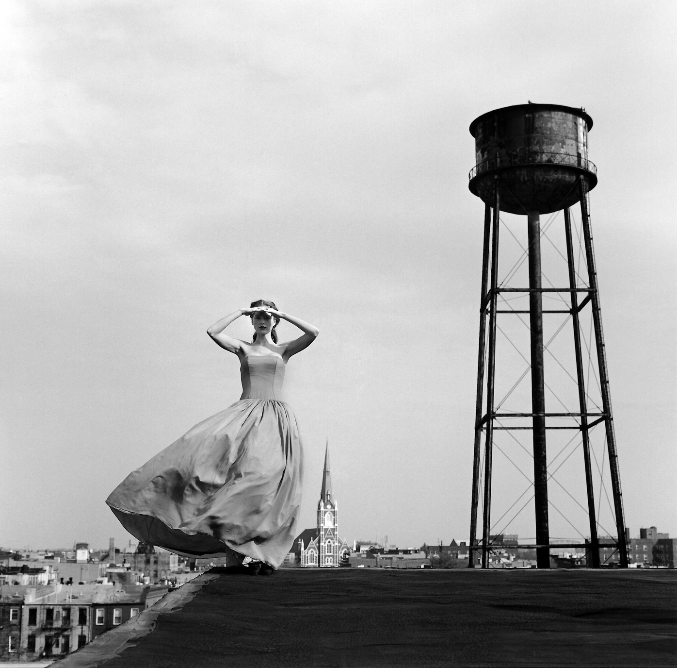   Viktoria standing on roof near water&nbsp;tower, Brooklyn, NY  2000 Silver gelatin print 27 x 27 cm (image) 56 x 66 cm (mount) 
