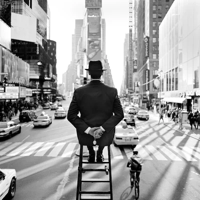 Man On Ladder in Times Square, New York, NY 1999 Silver gelatin paint 15.5 x 15.5" (image) 28 x 32" (frame)