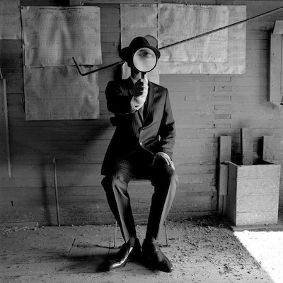   Colin with Magnifying Glass, Alberta, Canada  2004 Silver gelatin print 10.5 x 10.5" (image) 22 x 26" (mount) 