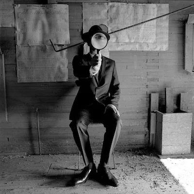 Colin with Magnifying Glass, Alberta, Canada 2004 Silver gelatin print 10.5 x 10.5" (image) 22 x 26" (mount)