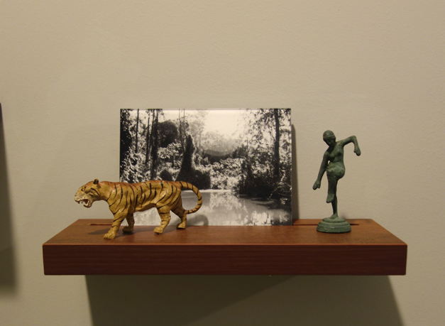  Donna ONG  Postcards from the Tropics (iii)  2016 Diasec print, wooden shelf, and tropical souvenirs (clay orchid on wood, antique ceramic parrot and vintage miniature ceramic birds Dimensions variable 