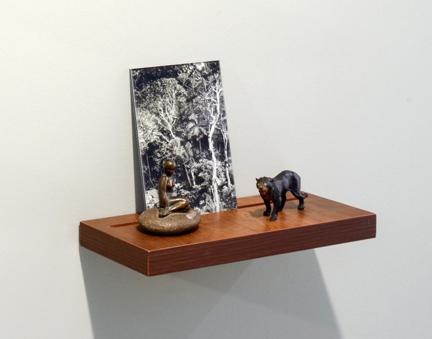 Donna ONG, Postcards from the Tropics (vii), 2016, Diasec print, wooden shelf, and tropical souvenirs (bronze statuette on pebble and vintage wooden panther), H21.5 x W32 x D13.6 cm. Credit-Fotograffiti (John Yuen) .jpg