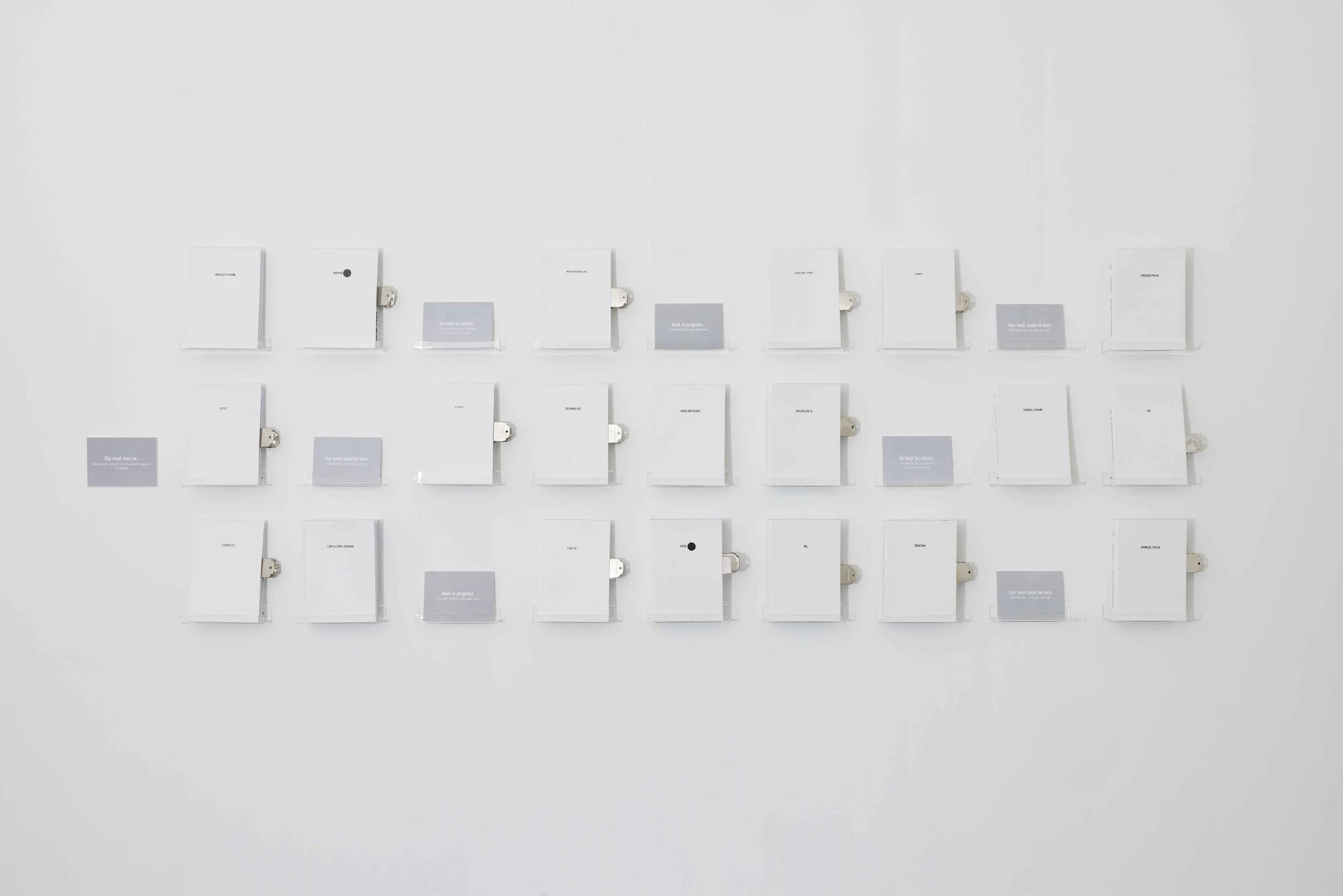  Joanne Lim  Two Copies for the Record  2025 – ongoing White faux leather bound book H29.7 x W21 x DVariable cm (each; installation) 