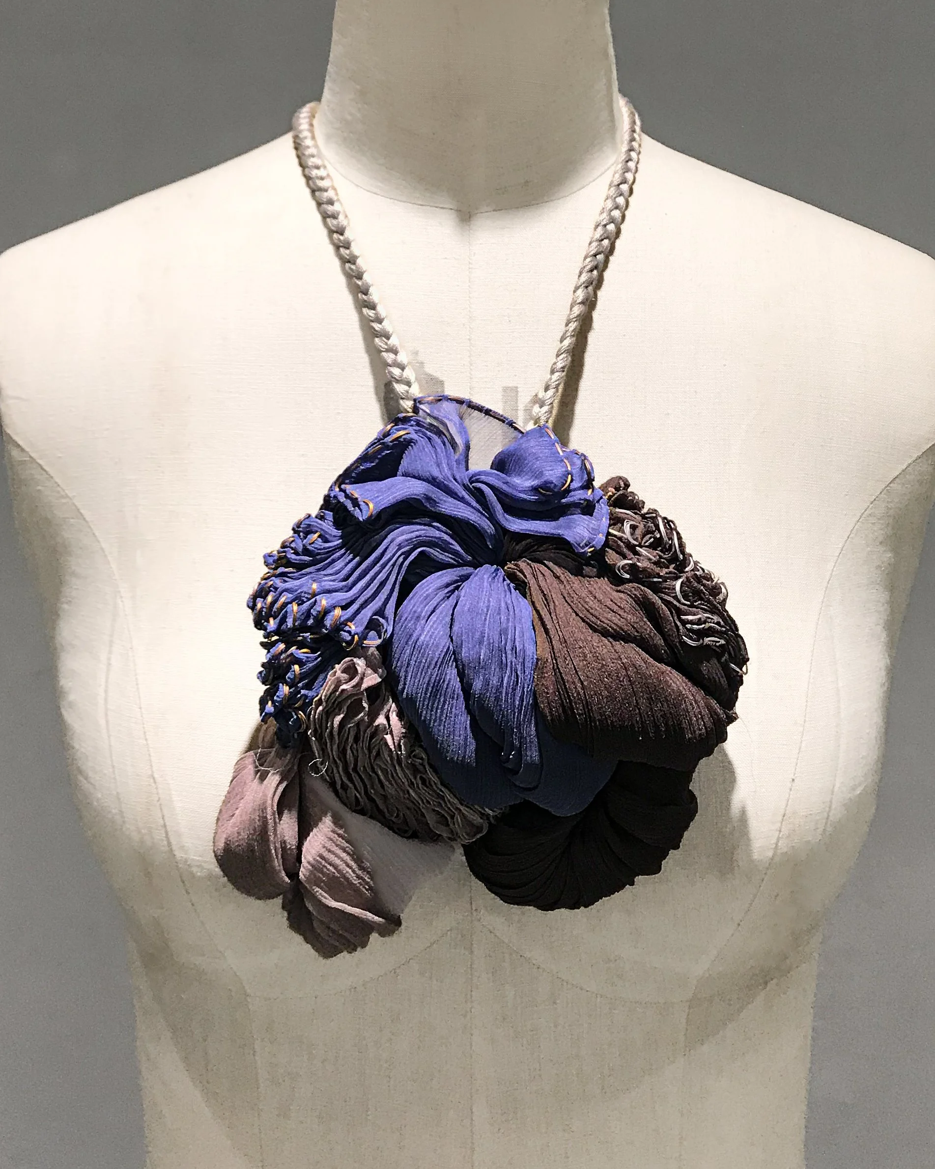  Grace Tan  n. 287 - kiku neckpiece construction in 7 rectangles  2010 Smoked wood, blueberry and dusk silk chiffon with cotton braid Dimensions variable 