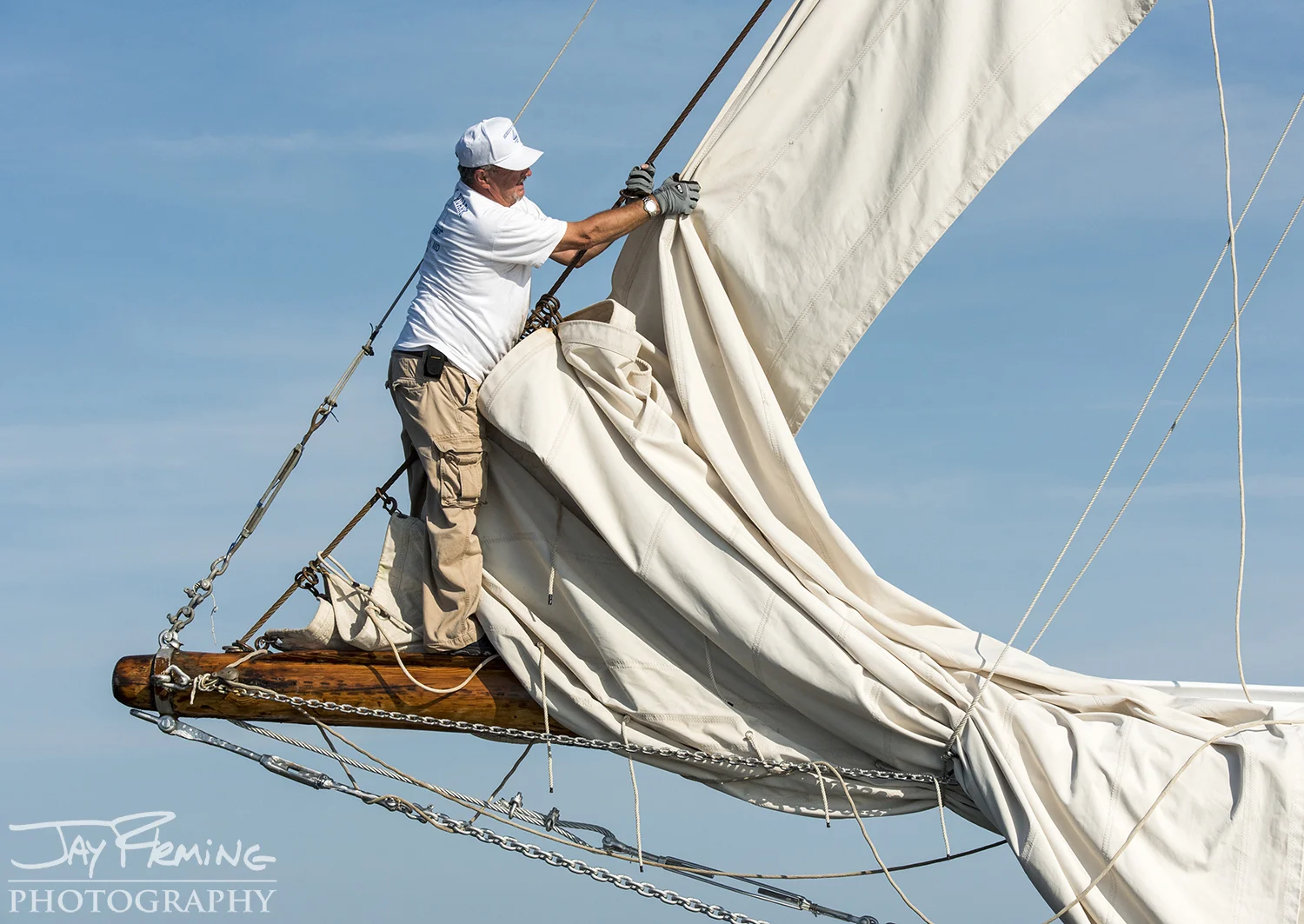 A crew member on the Rebecca T. Ruark prepares the jib&nbsp;