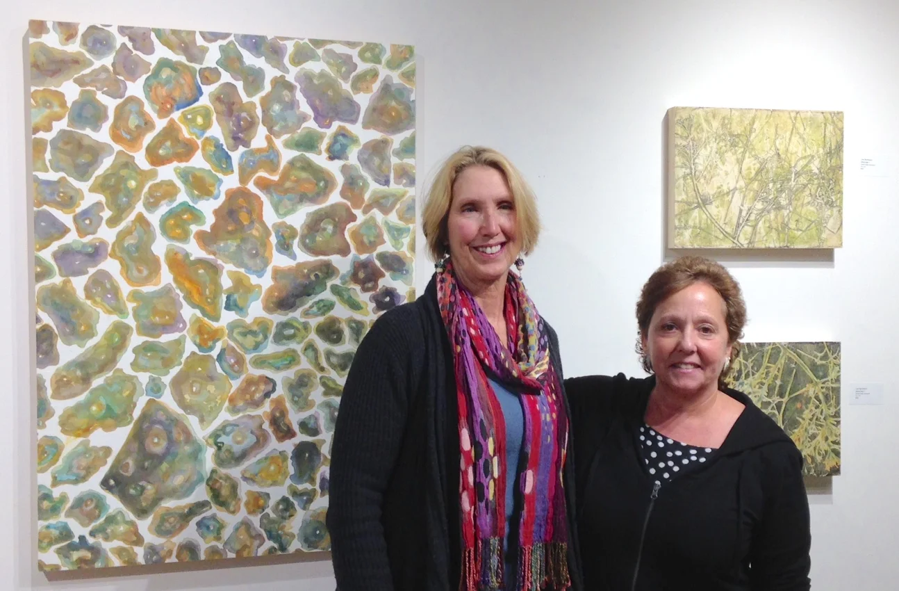 Lisa Barthelson and Kay Hartung in front of Lisa's work.