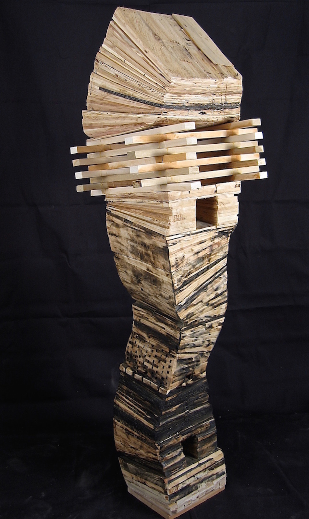 Leslie Zelamsky, Resurrection, wood and asphalt shingles, 65x19x19, $3,700