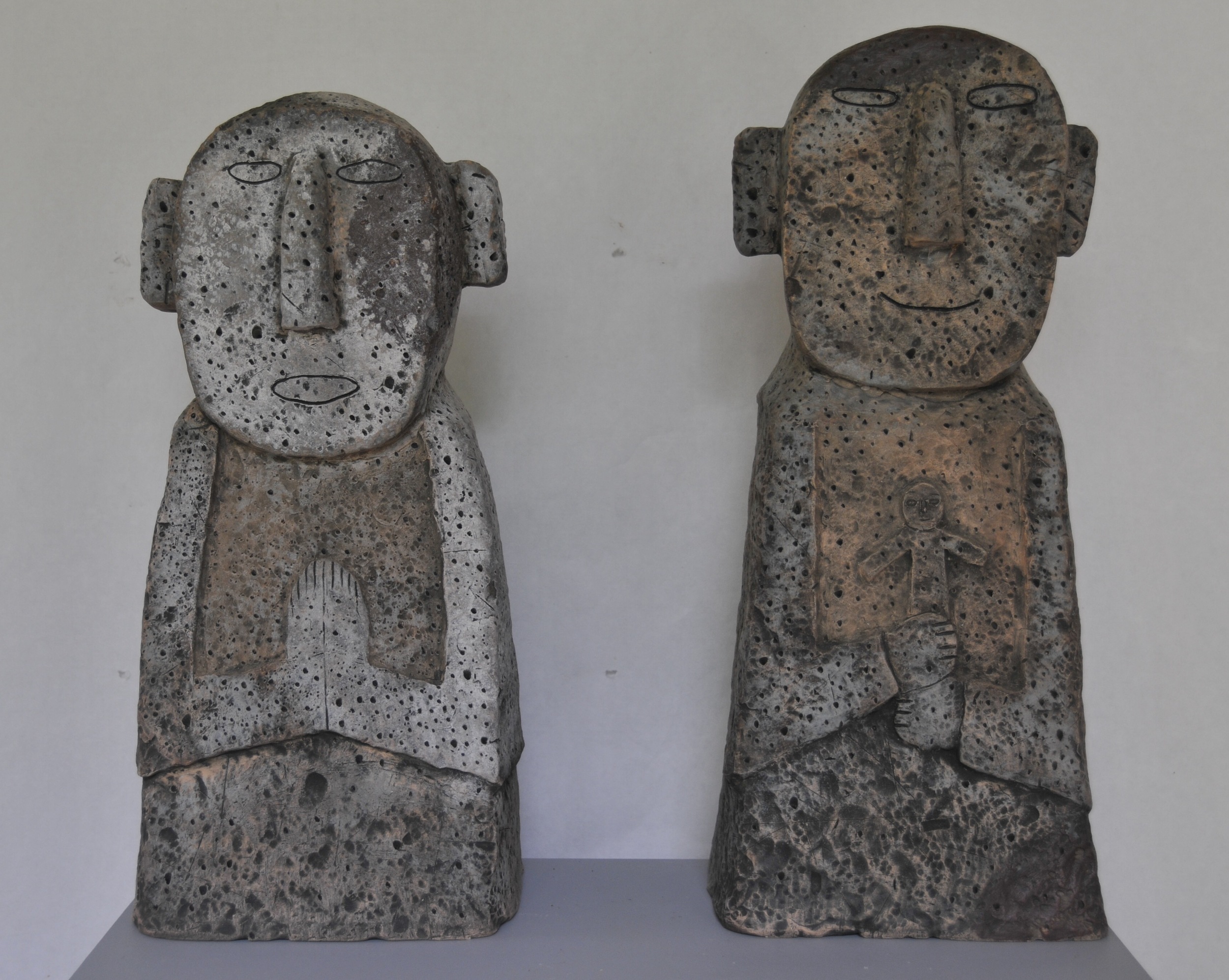  Jaeok Lee  Guardians of family , Clay, 9"x7"x22" and 9"x7x20" 