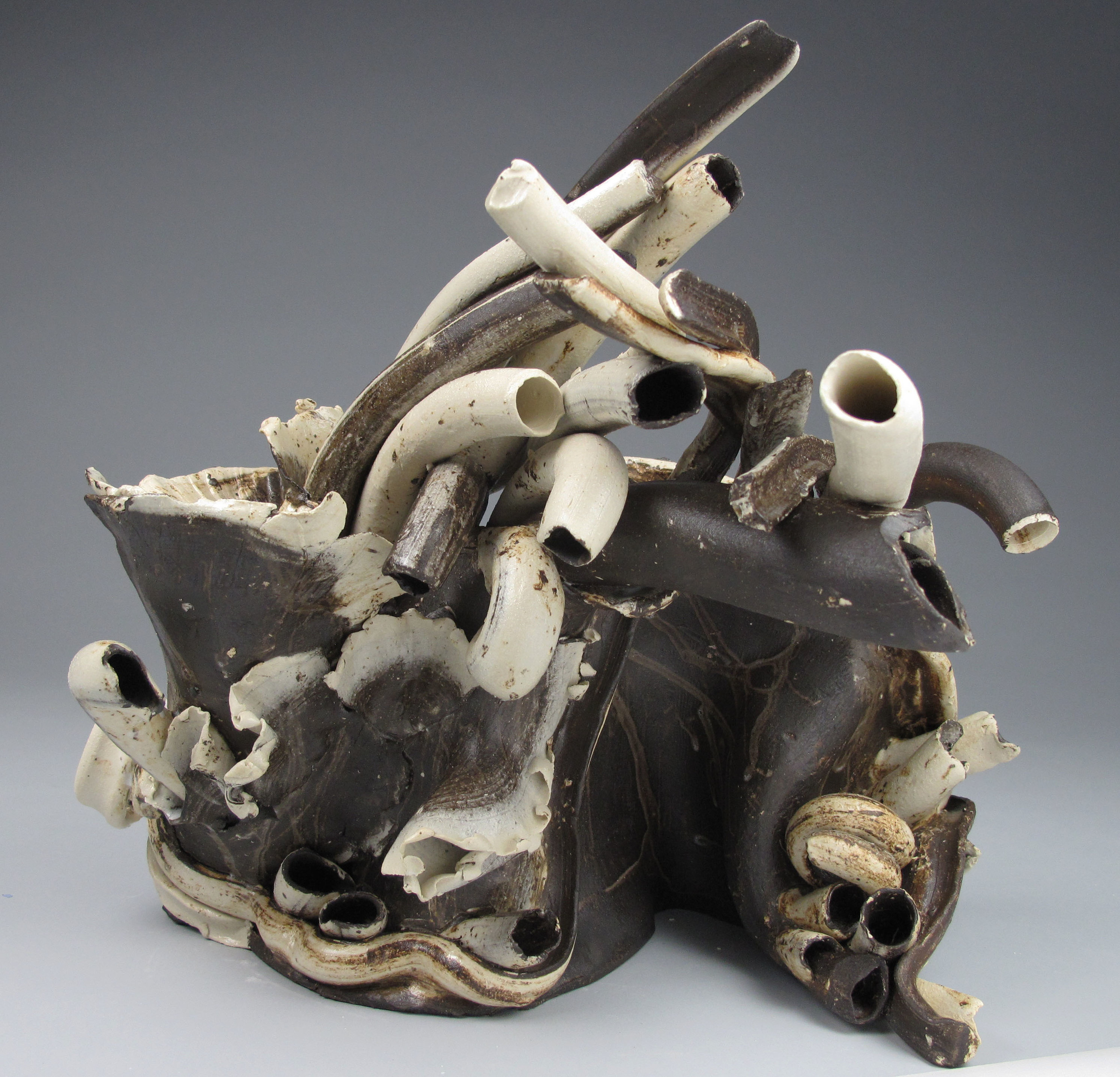   Sara Fine-Wilson ,  Forward Fold , mixed ceramic, 12x10x8 