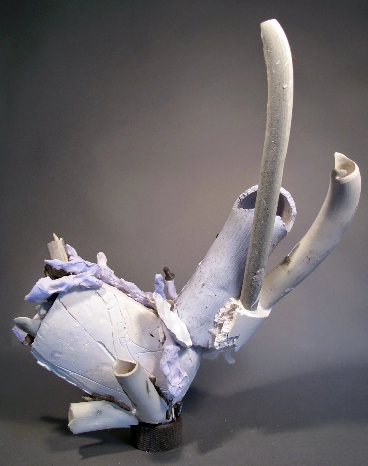 Milk Bone Balance , clay, plaster, silicone and found objects, 21"x21"x7"