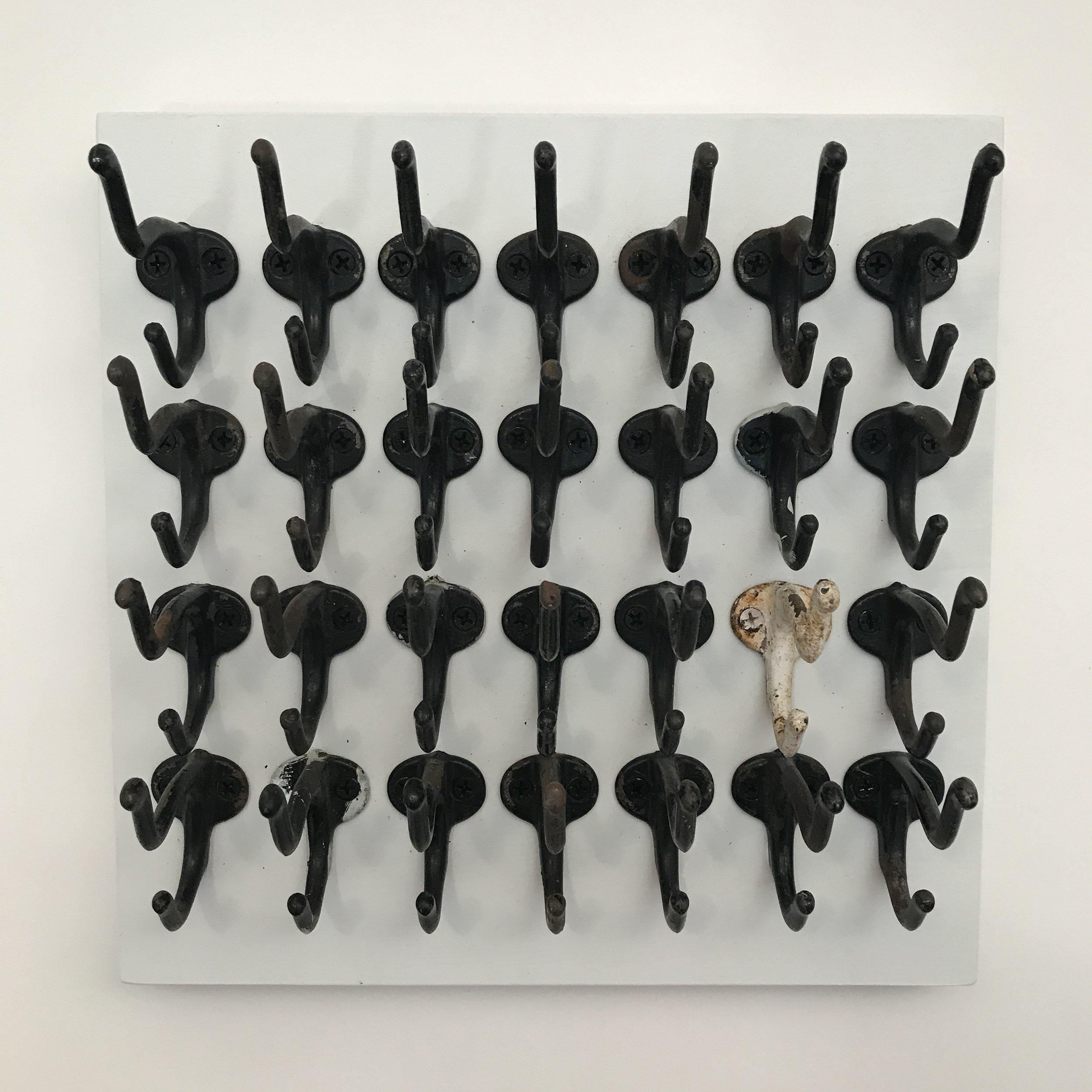  Doug Cross,  Fitting In , Metal hooks mounted on wooden box. 12”x12”x5” 