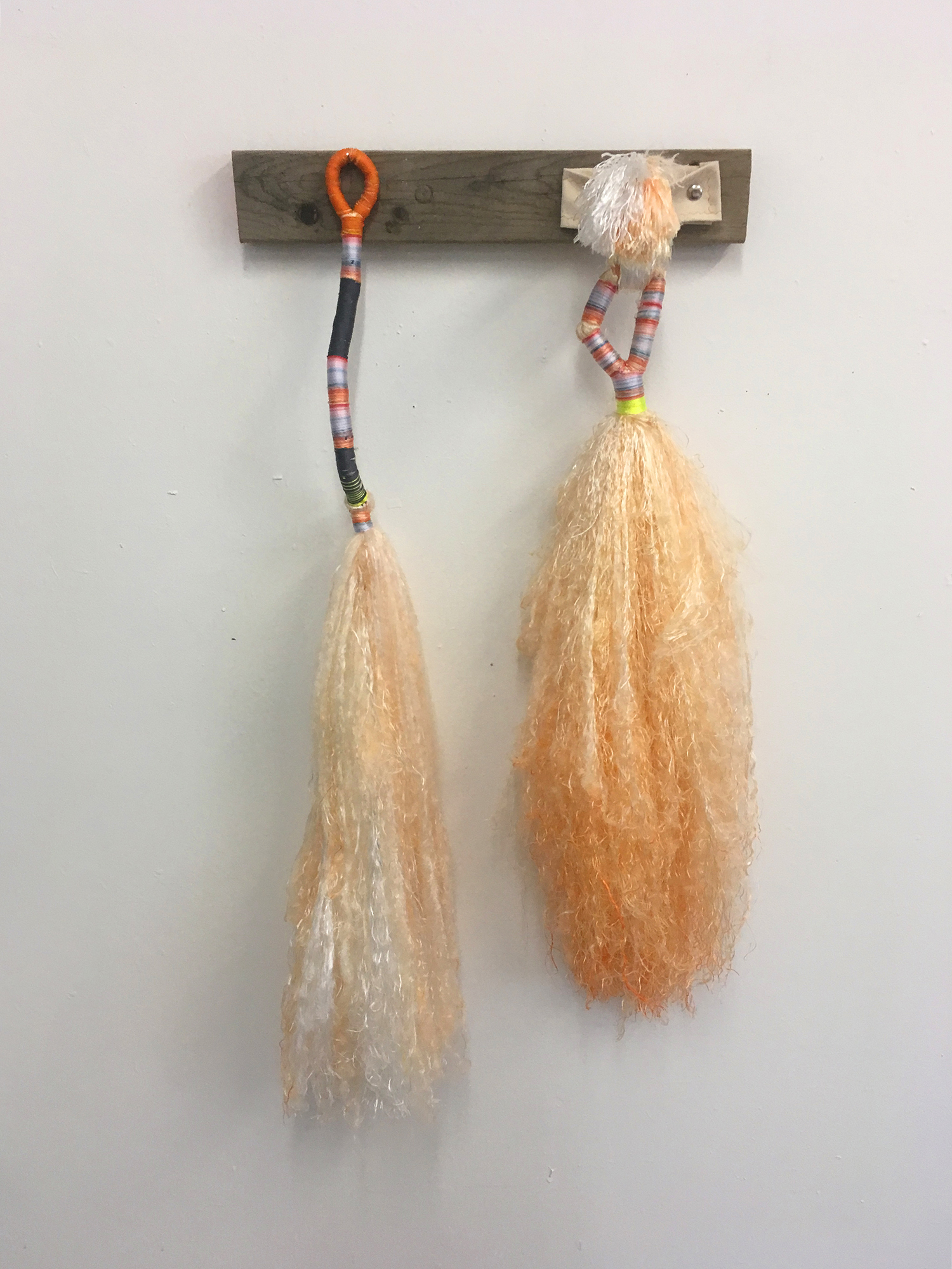  Daniel Zeese,  Two Orange Brooms,  bound dyed nylon and canvas fixture, 36x24x6 