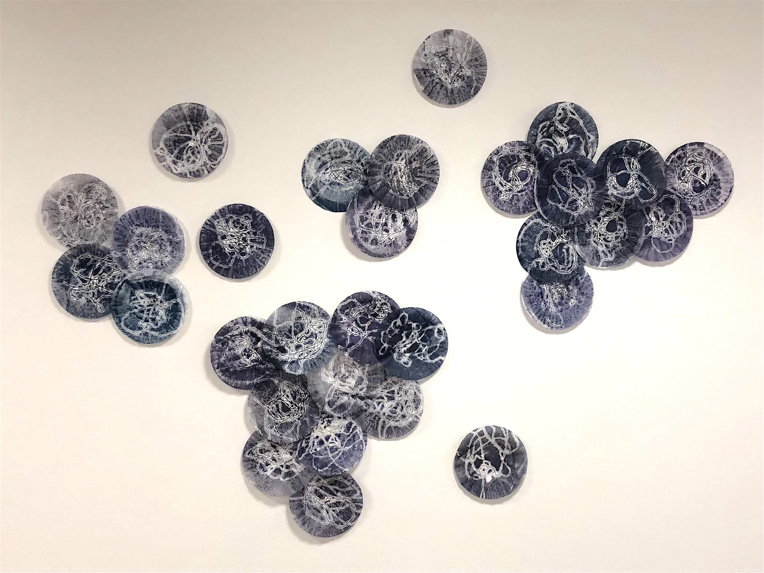 Kay Hartung, Microbial Installation 2 , encaustic monotype, coffee filters, variable size