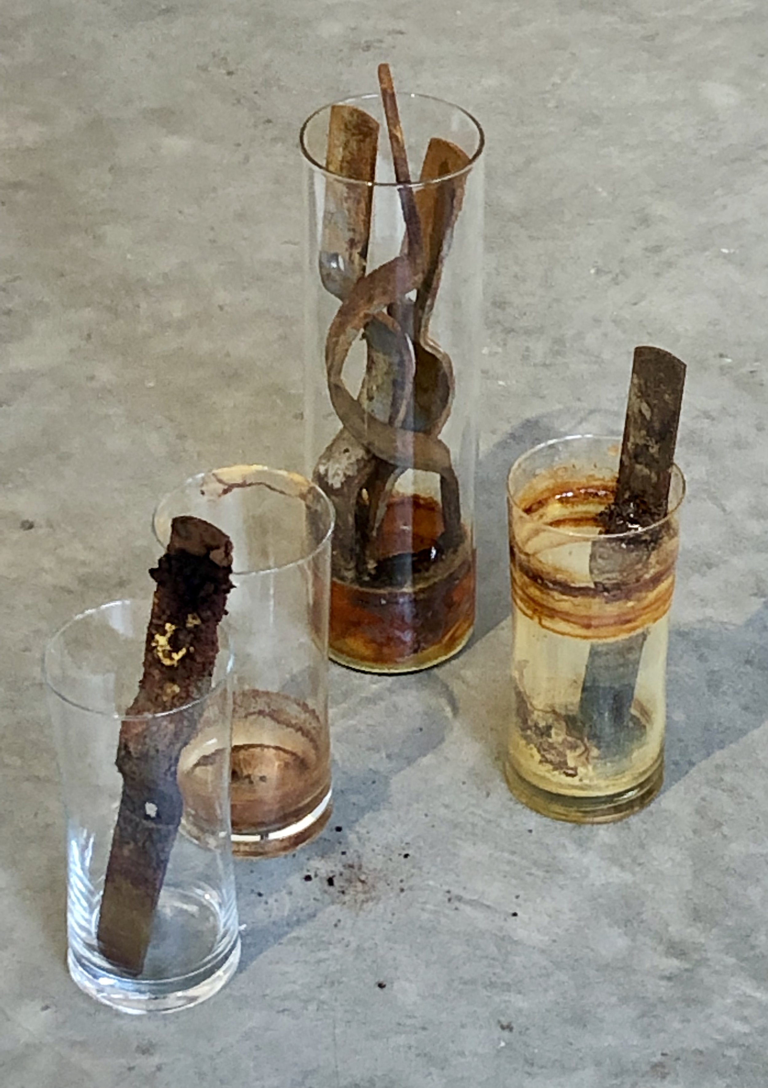 Rust Farm Installation , glass vessels, pipe strap, vinegar, salt, water