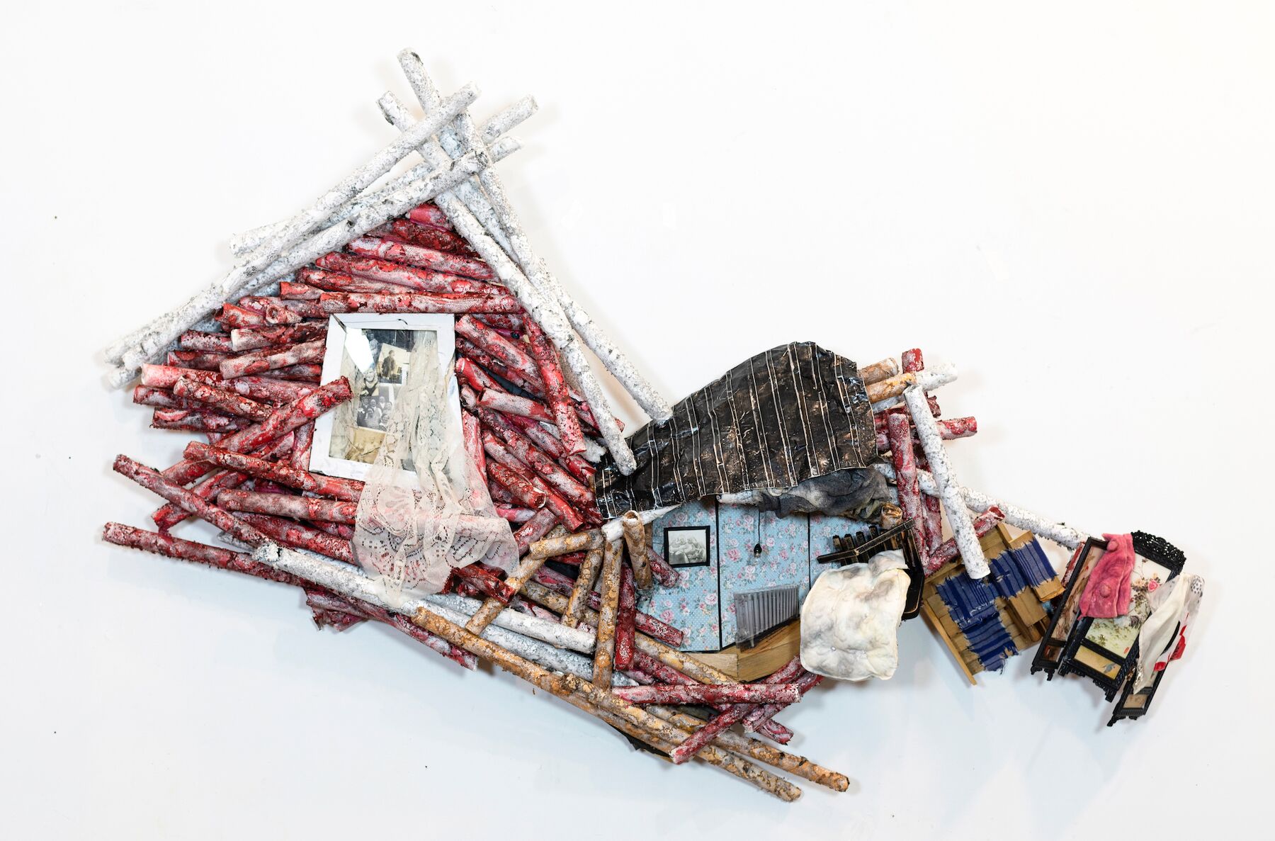   Gone Home/Home Gone: Attic Bedroom , acrylic on molded Tyvek; mixed media and found objects, 28 x 54 x 6 inches. 
