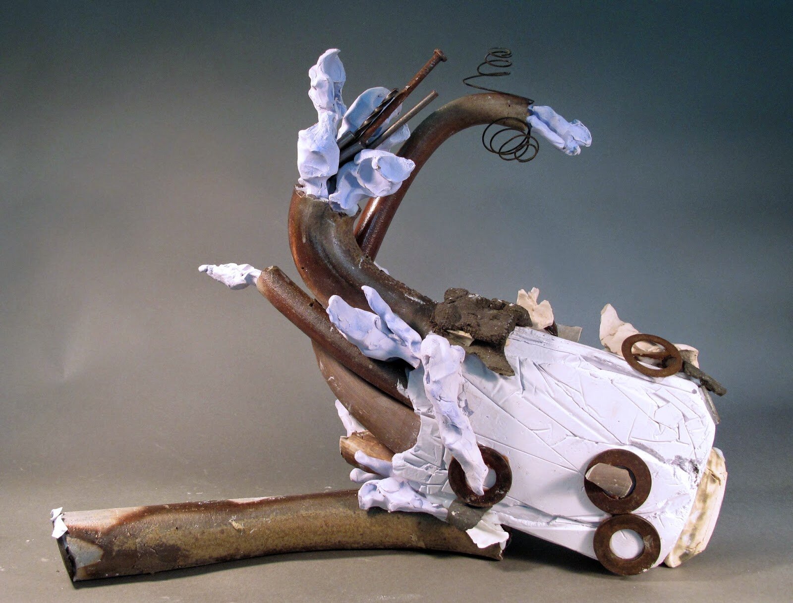  Sara Fine-Wilson,  Milk Bone Spewing,  Clay, Plaster, Metal, Found Objects, Silicone, 17x17x6 