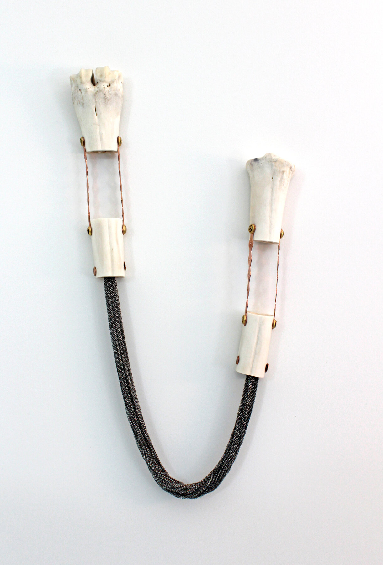    Chainged    moose tibia, chain and mixed-media, 19.5 x 9 x 2 inches 