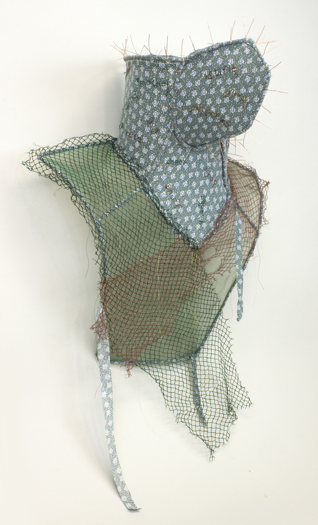    Muffle    reclaimed fabric, vegetable net, thread, copper, 32 x 22 x 14 inches 