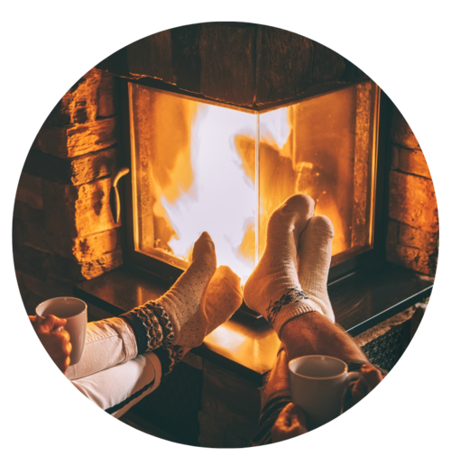 Bare Feet In Front Of Indoor Fireplace