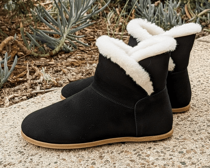 Rhizal Noma black suede sheepskin grounding boot lifestyle 3 min.png