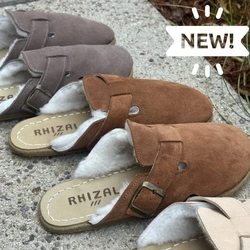 3 pairs of rhizal kuyu grounding shoes with copper lined with sheepskin, atop a stone slab