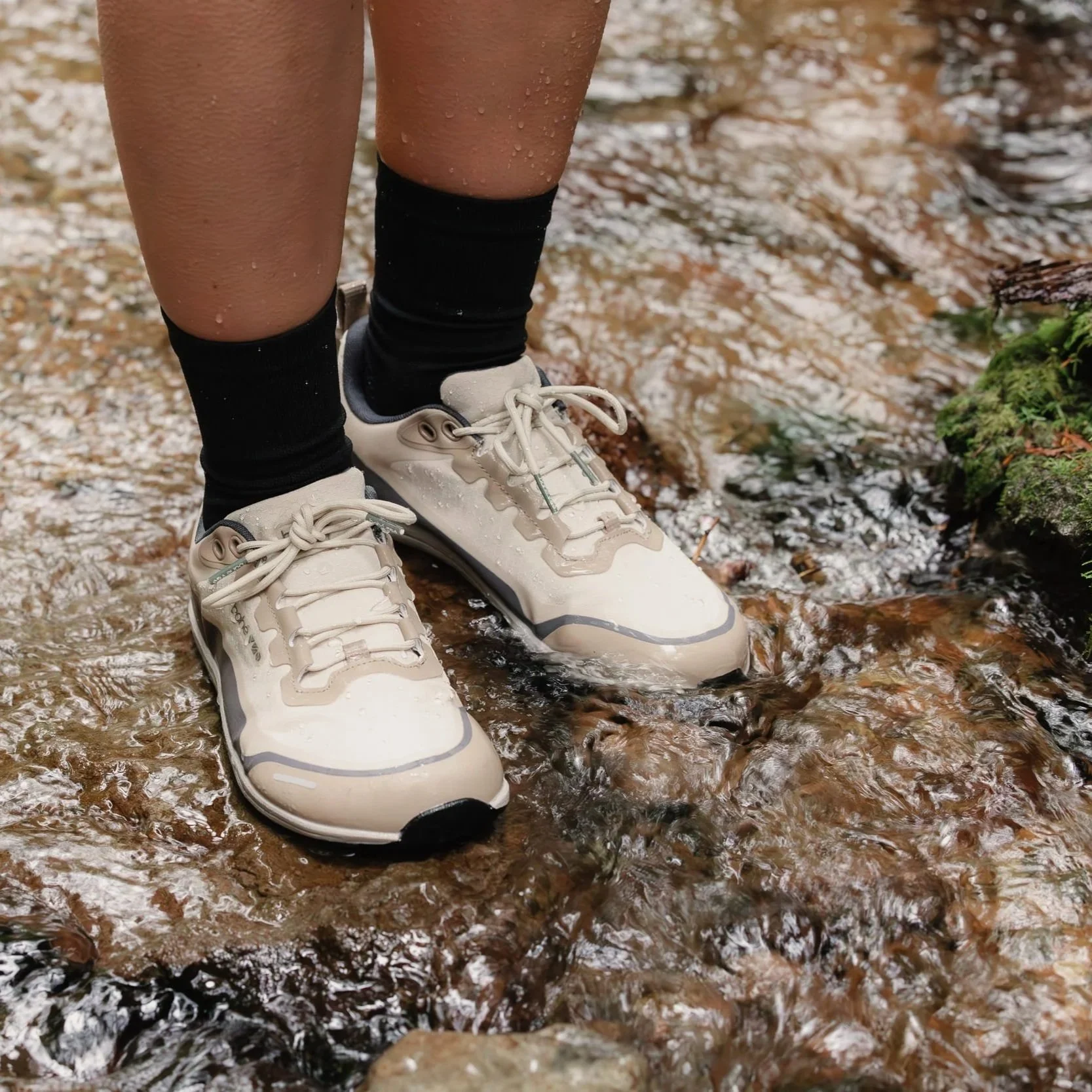 wearing bahe tundra flex rewild waterproof grounded running shoes in water